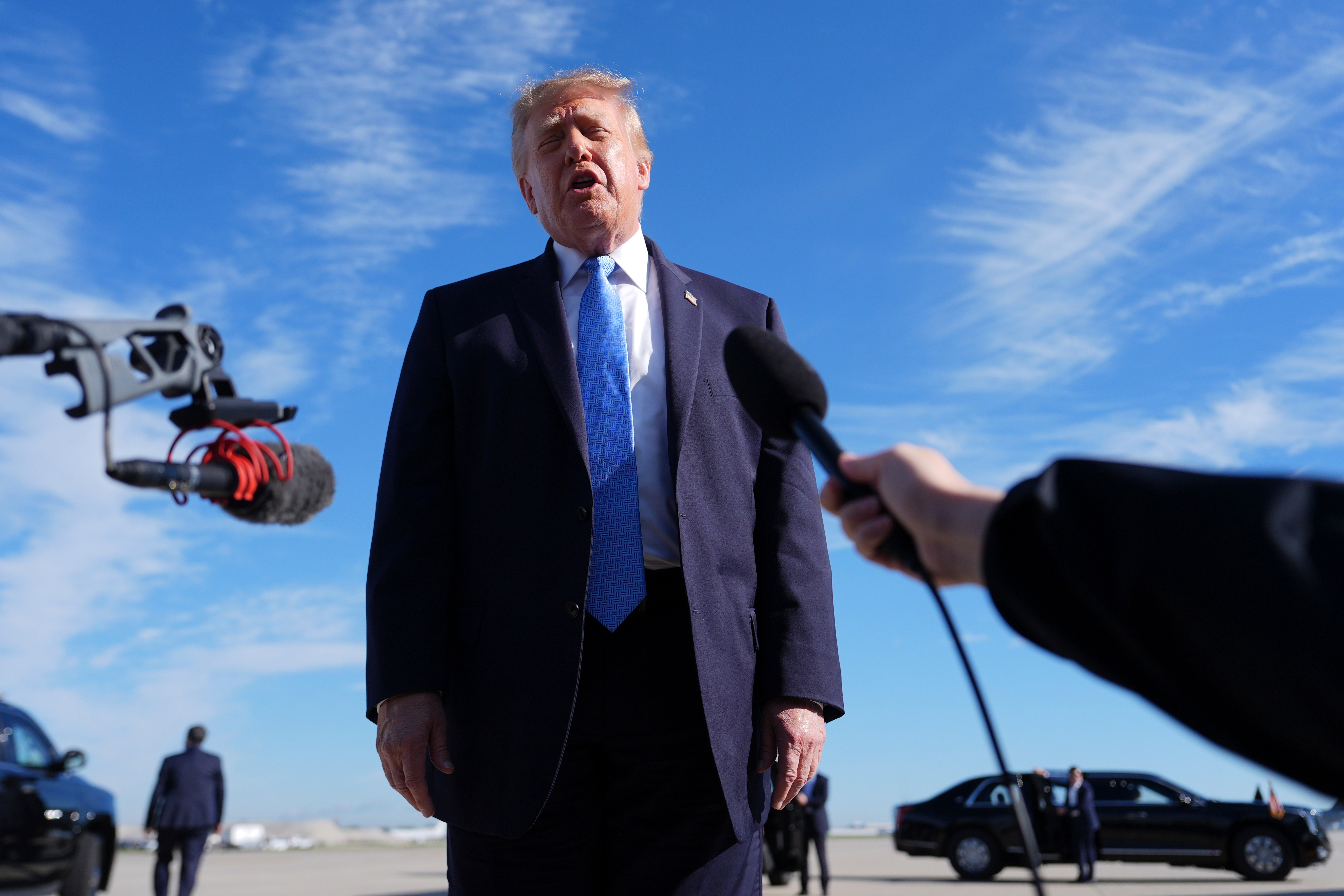 President Donald Trump speaks with reporters upon arriving at Chicago O'Hare International Airport, Sunday, Sept. 27, 2026, in Chicago. (AP Photo/Julia Demaree Nikhinson)
