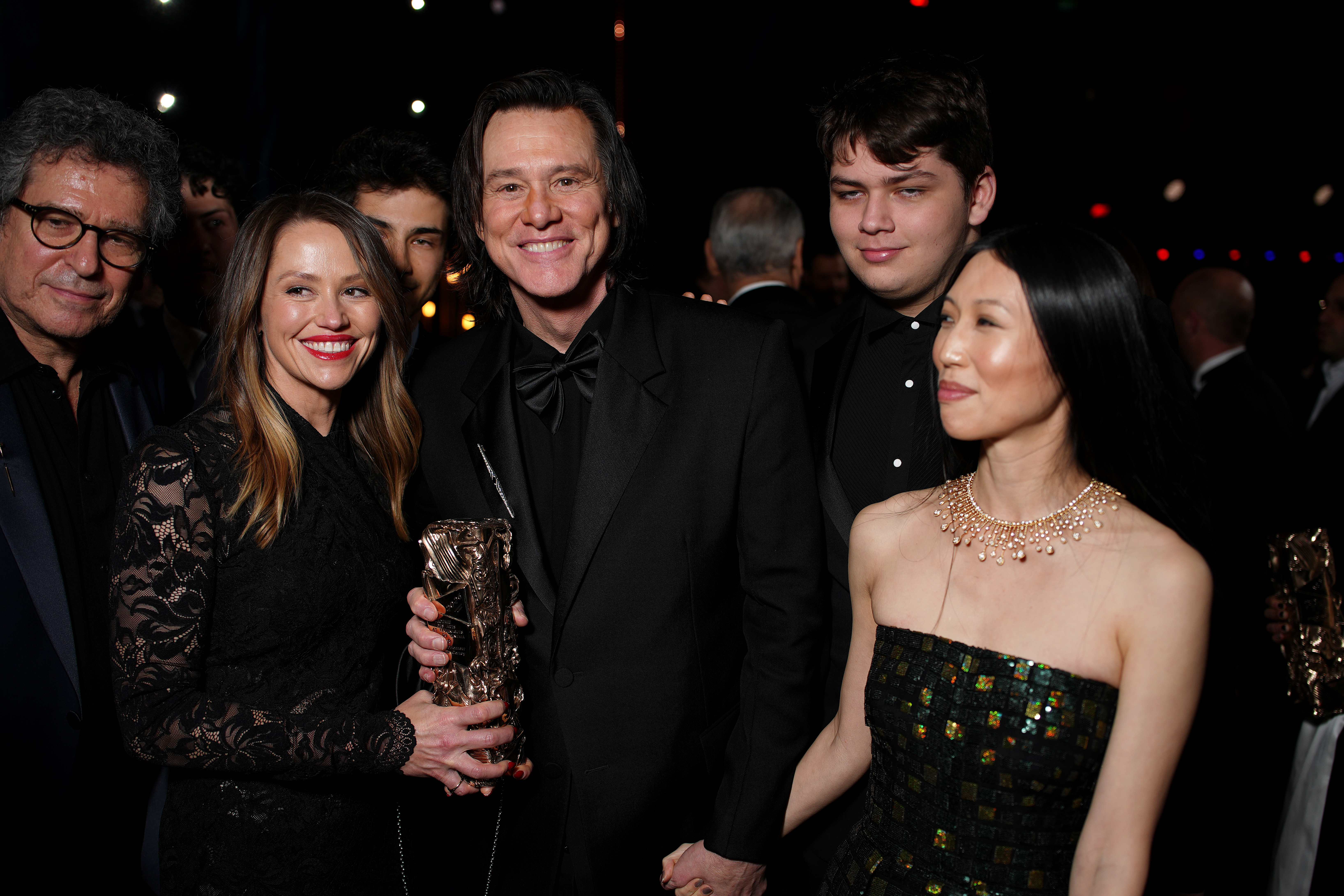 PARIS, FRANCE - FEBRUARY 26: Jane Erin Carrey, Jim Carrey, Min Ah and Riley Jackson pose during the 51st Cesar Film Awards at L'Olympia on February 26, 2026 in Paris, France. (Photo by Francois Durand/Getty Images)
