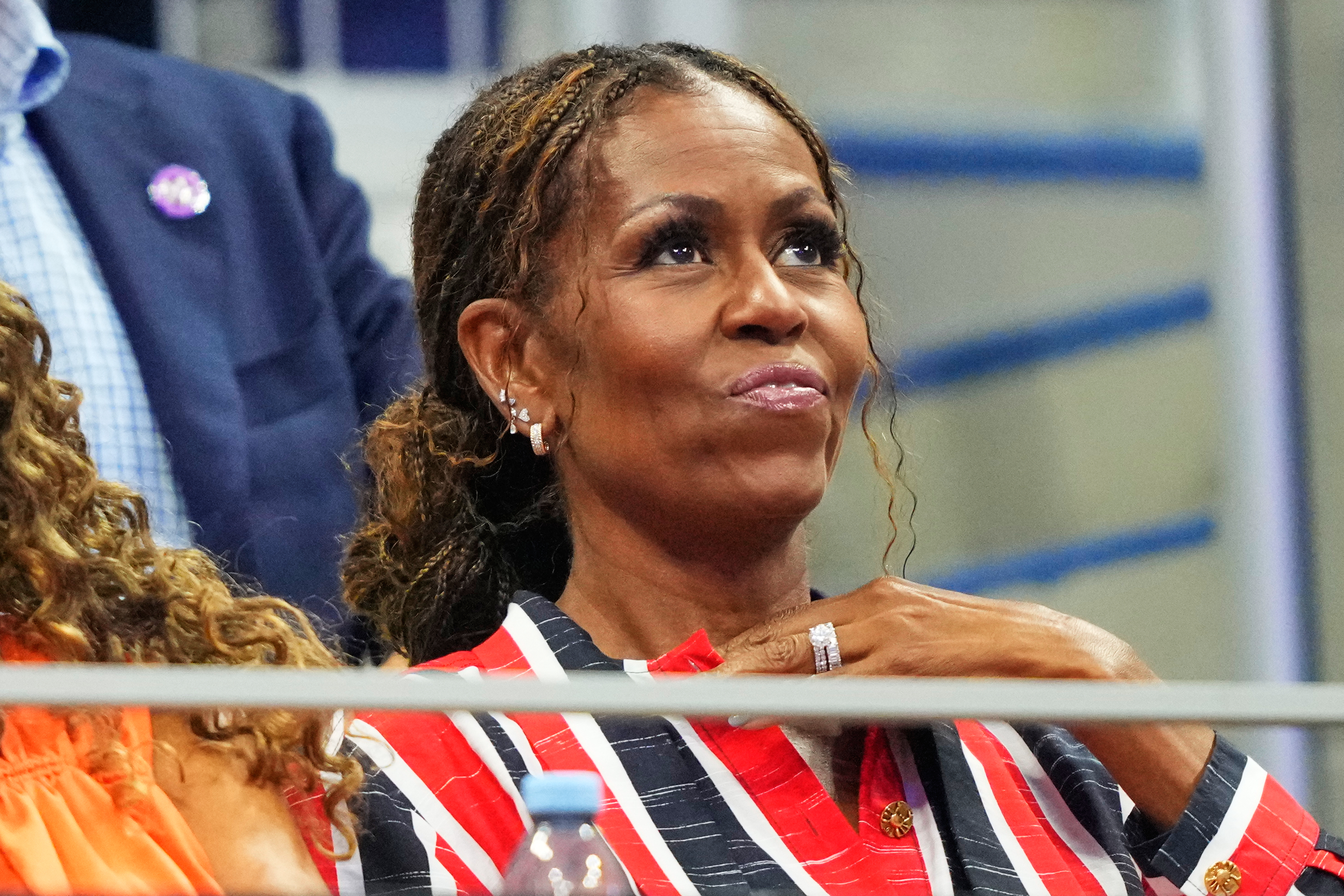 Former first lady Michelle Obama attends a match between Aryna Sabalenka, of Belarus, and Jessica Pegula, of the United States, during the women's singles semifinals of the U.S. Open tennis championships, Thursday, Sept. 10, 2026, in New York. (AP Photo/Yuki Iwamura)