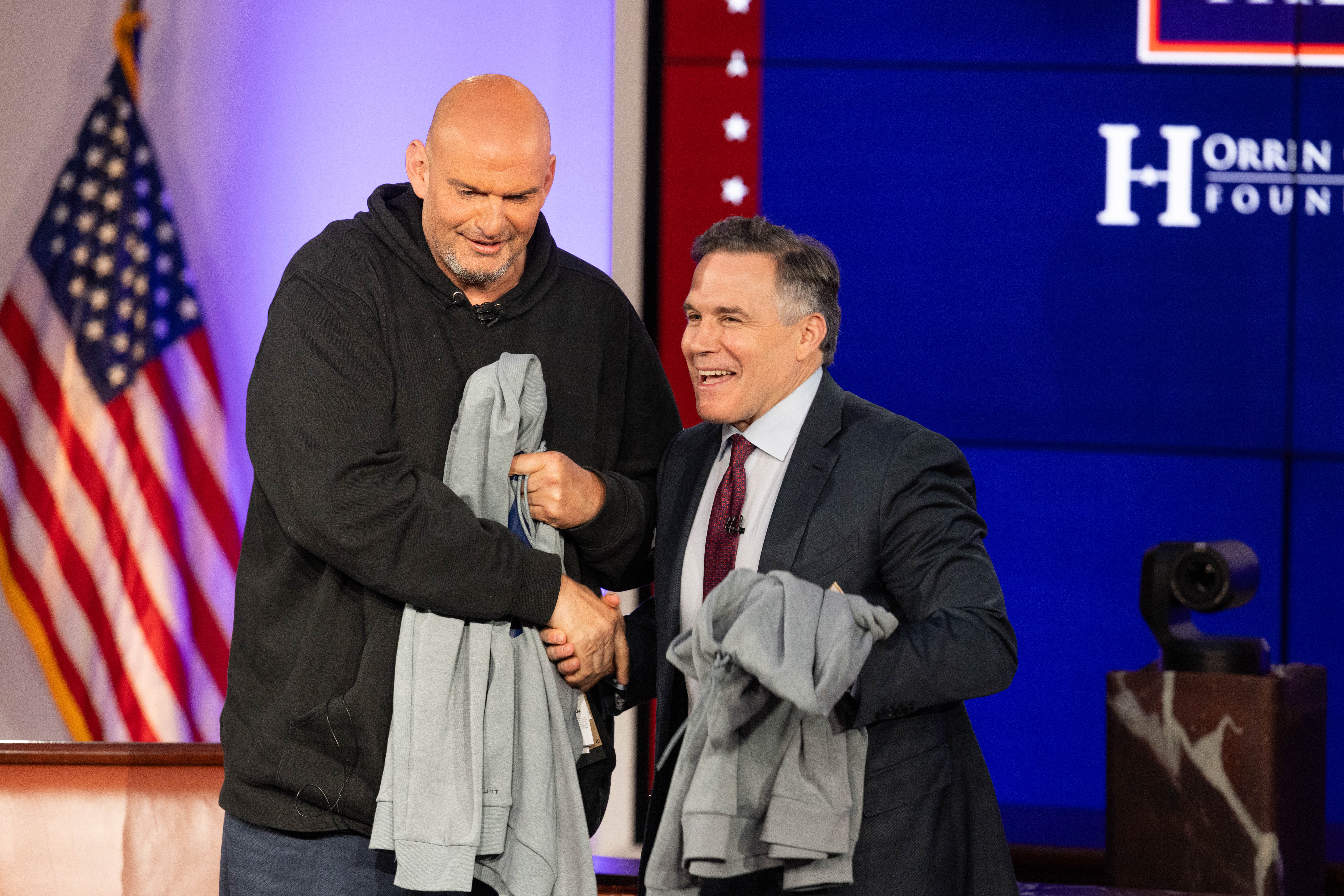 BOSTON, MASSACHUSETTS - JUNE 2: U.S. Senators John Fetterman (D-PA) and David McCormick (R-PA) shake hands after the sixth installment of The Senate Project moderated by FOX NEWS anchor Shannon Bream at the Edward M. Kennedy Institute for the United States Senate on June 2, 2025 in Boston, Massachusetts. The Senate Project is an initiative between the Kennedy Institute and the Hatch Foundation that brings together sitting US Senators from opposing parties for an Oxford-style exchange of ideas about current political issues before a live audience. (Photo by Scott Eisen/Getty Images)