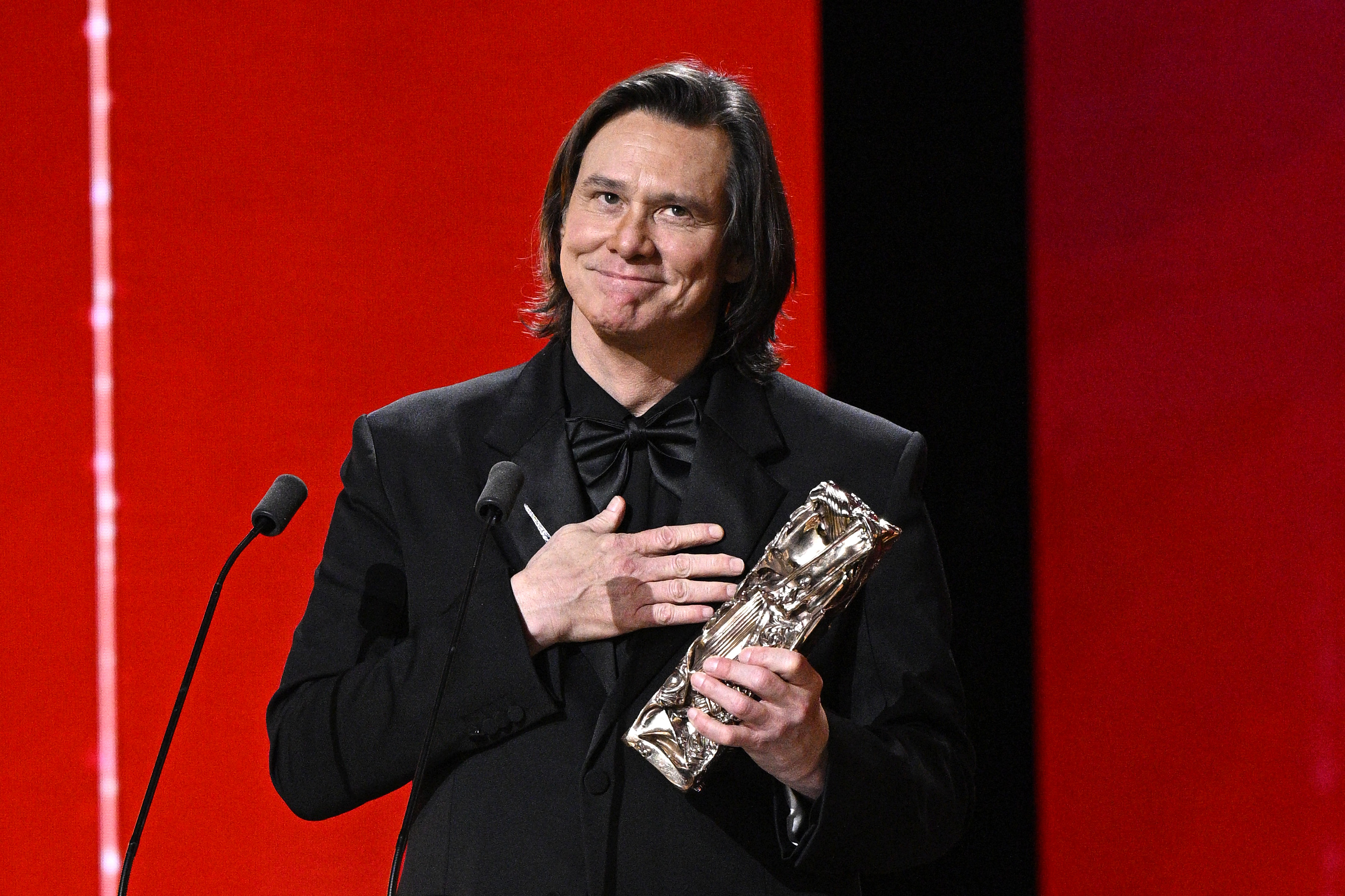PARIS, FRANCE - FEBRUARY 26: Jim Carrey accepts the Honorary Cesar Award during the 51st Cesar Film Awards at L'Olympia on February 26, 2026 in Paris, France. (Photo by Kristy Sparow/Getty Images)