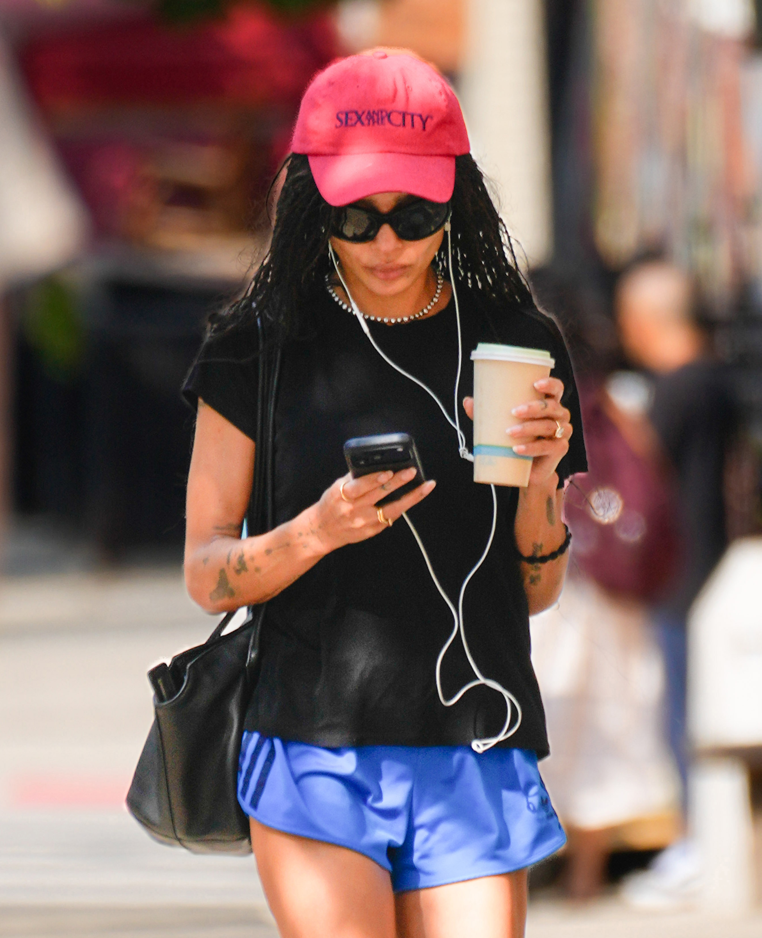 NEW YORK, NY - AUGUST 28: Zoe Kravitz wears a “Sex and the City” cap on August 28, 2026 in New York City.  (Photo by XNY/Star Max/GC Images) *** Local Caption ***Zoe Kravitz