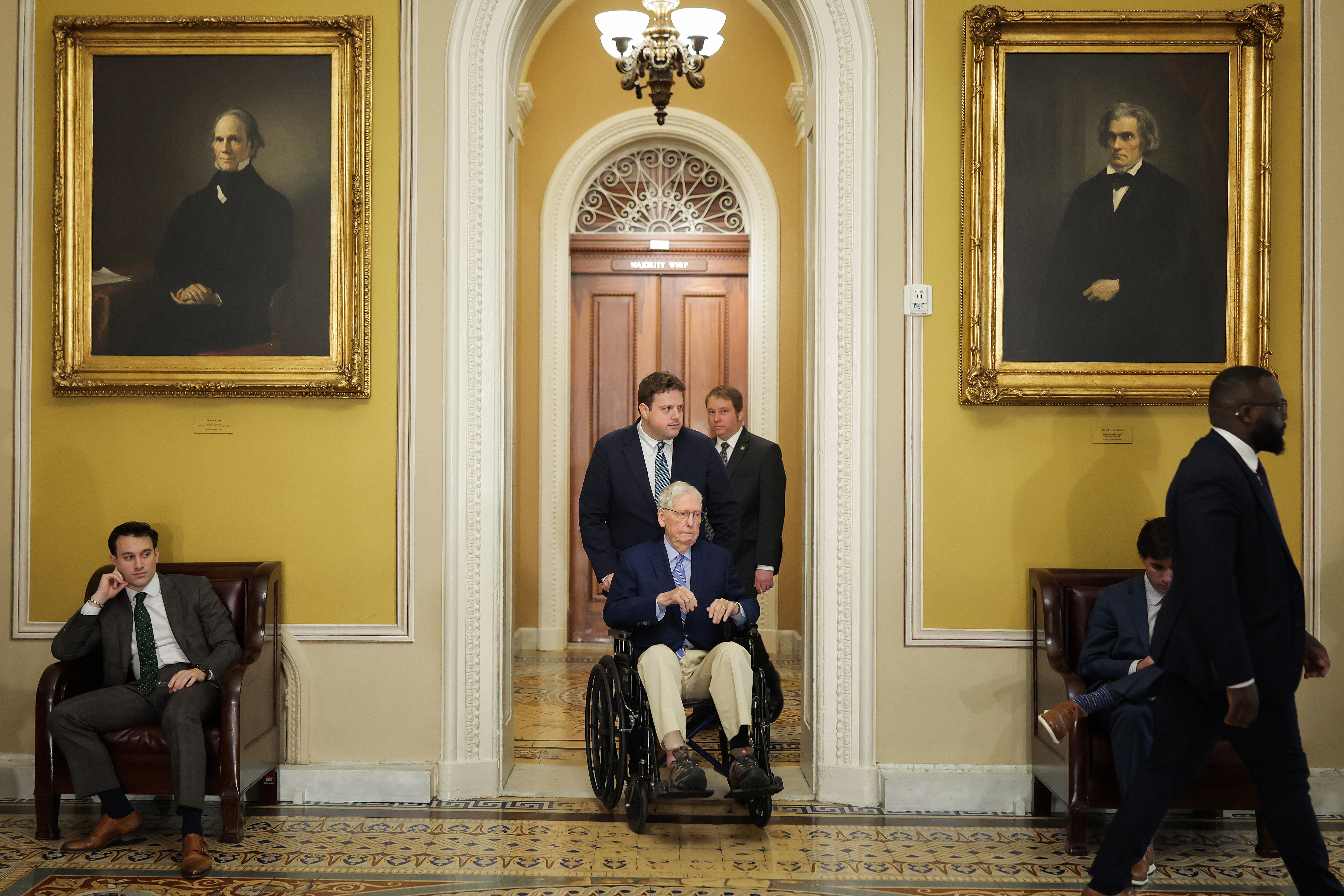 Sen Mitch McConnell (R-KY) is pushed in a wheelchair through the Capitol during weekly policy luncheons on April 21, 2026 in Washington, DC (Photo by Heather Diehl/Getty Images)