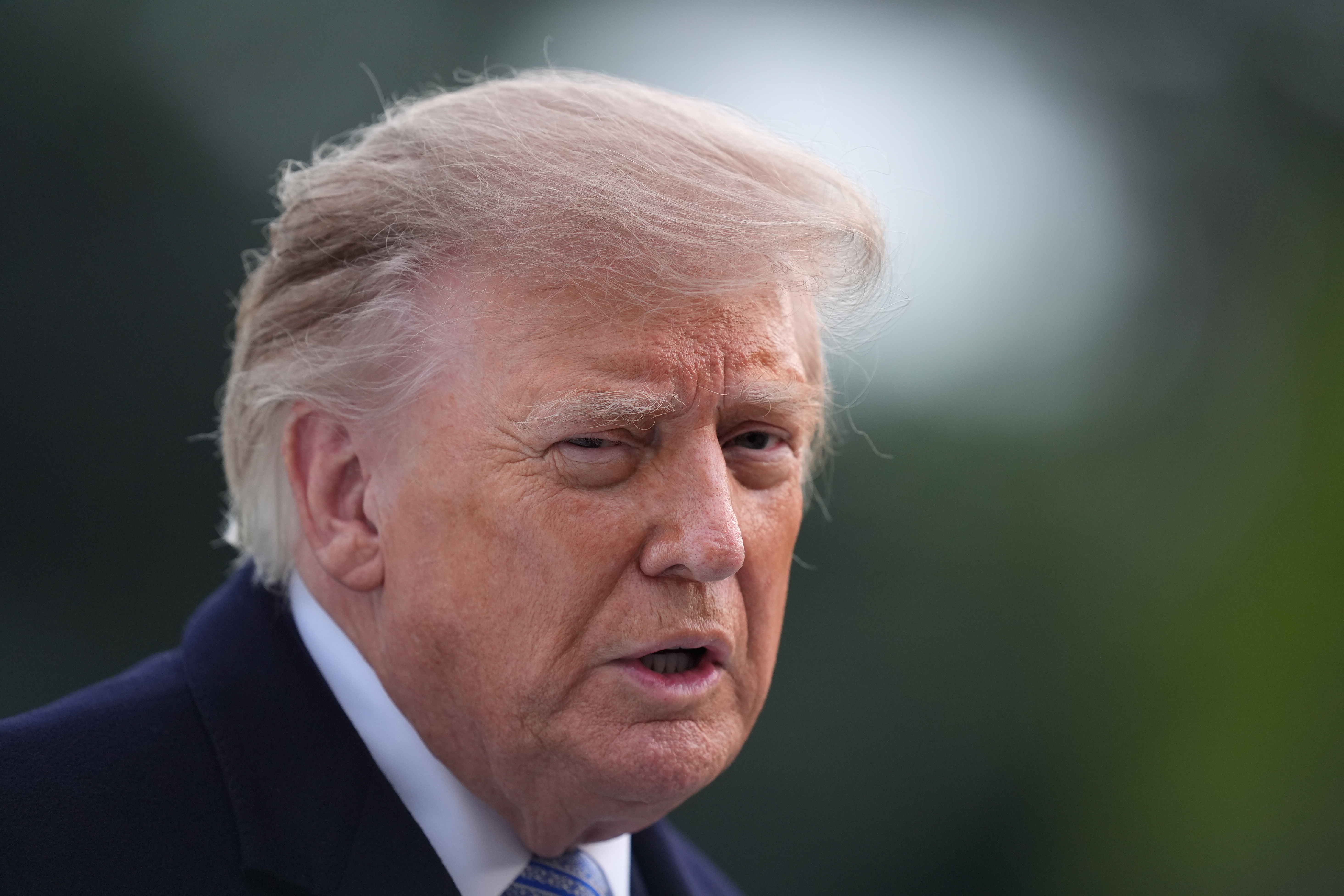 President Donald Trump talks with reporters on the South Lawn Wednesday, Sept. 23, 2026, in Washington, after greeting China's President Xi Jinping at Joint Base Andrews. (AP Photo/Manuel Balce Ceneta)
