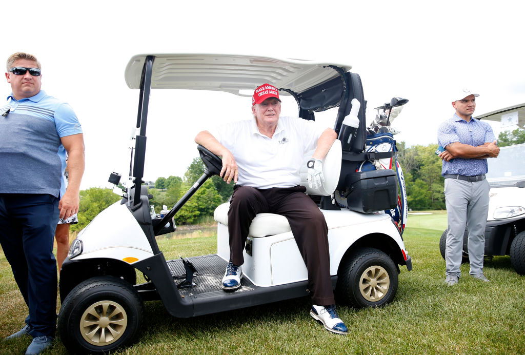 BEDMINSTER, NEW JERSEY - JULY 28: Former U.S. President Donald Trump waits on the ninth tee in his golf cart during the pro-am prior to the LIV Golf Invitational - Bedminster at Trump National Golf Club Bedminster on July 28, 2022 in Bedminster, New Jersey. (Photo by Jonathan Ferrey/LIV Golf via Getty Images)
