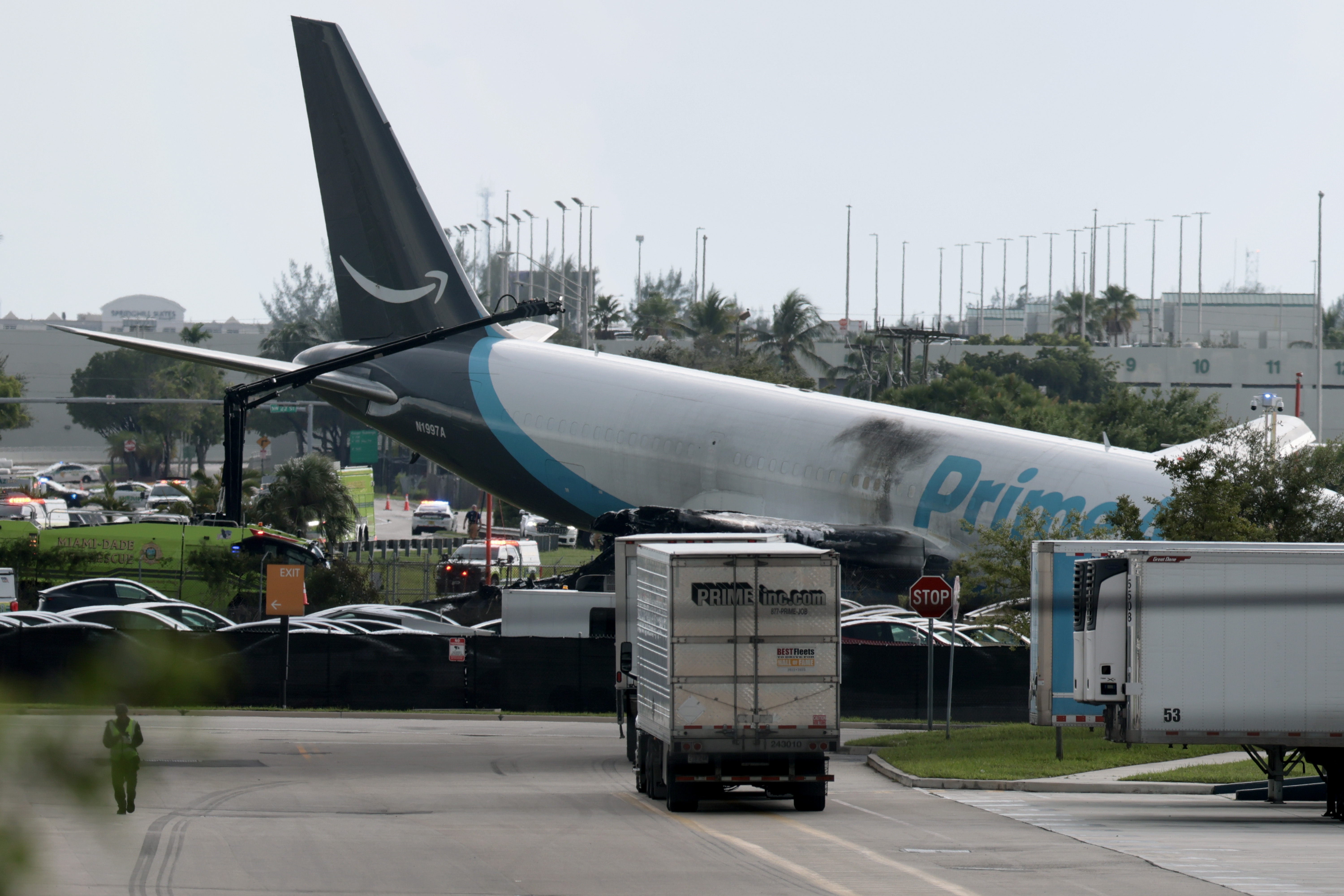An Amazon cargo plane is seen after it crashed at Miami International Airport on September 06, 2026 in Miami, Florida. In a statement, the Federal Aviation Administration said Prime Air Flight 7598...
