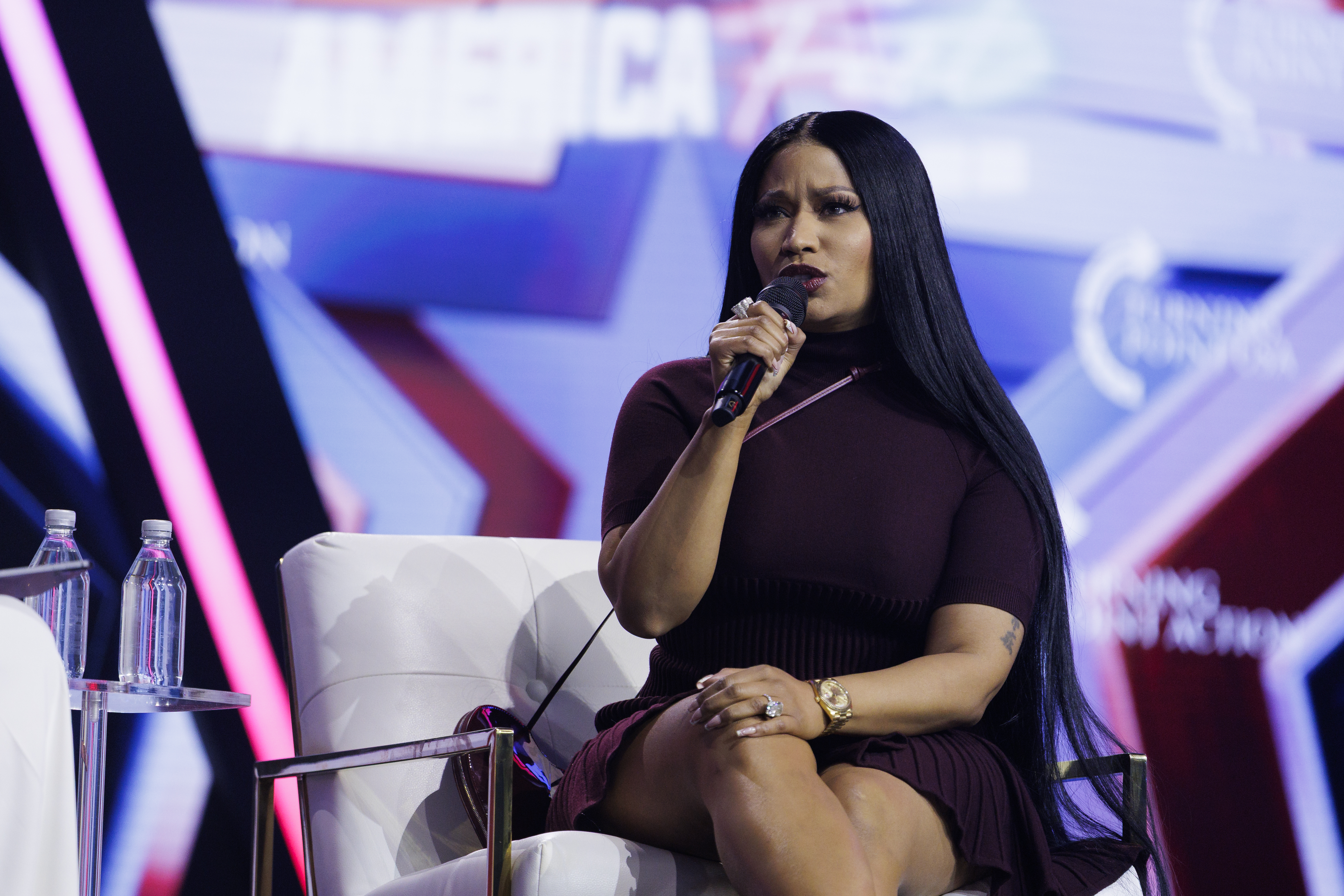 PHOENIX, ARIZONA - DECEMBER 21: Surprise guest Nicki Minaj is interviewed by Erika Kirk on the final day of Turning Point USA's annual AmericaFest conference at the Phoenix Convention Center on December 21, 2025 in Phoenix, Arizona. Minaj spoke about her frustrations with California Governor Gavin Newsom, and about why she has embraced the conservative movement. (Photo by Caylo Seals/Getty Images)