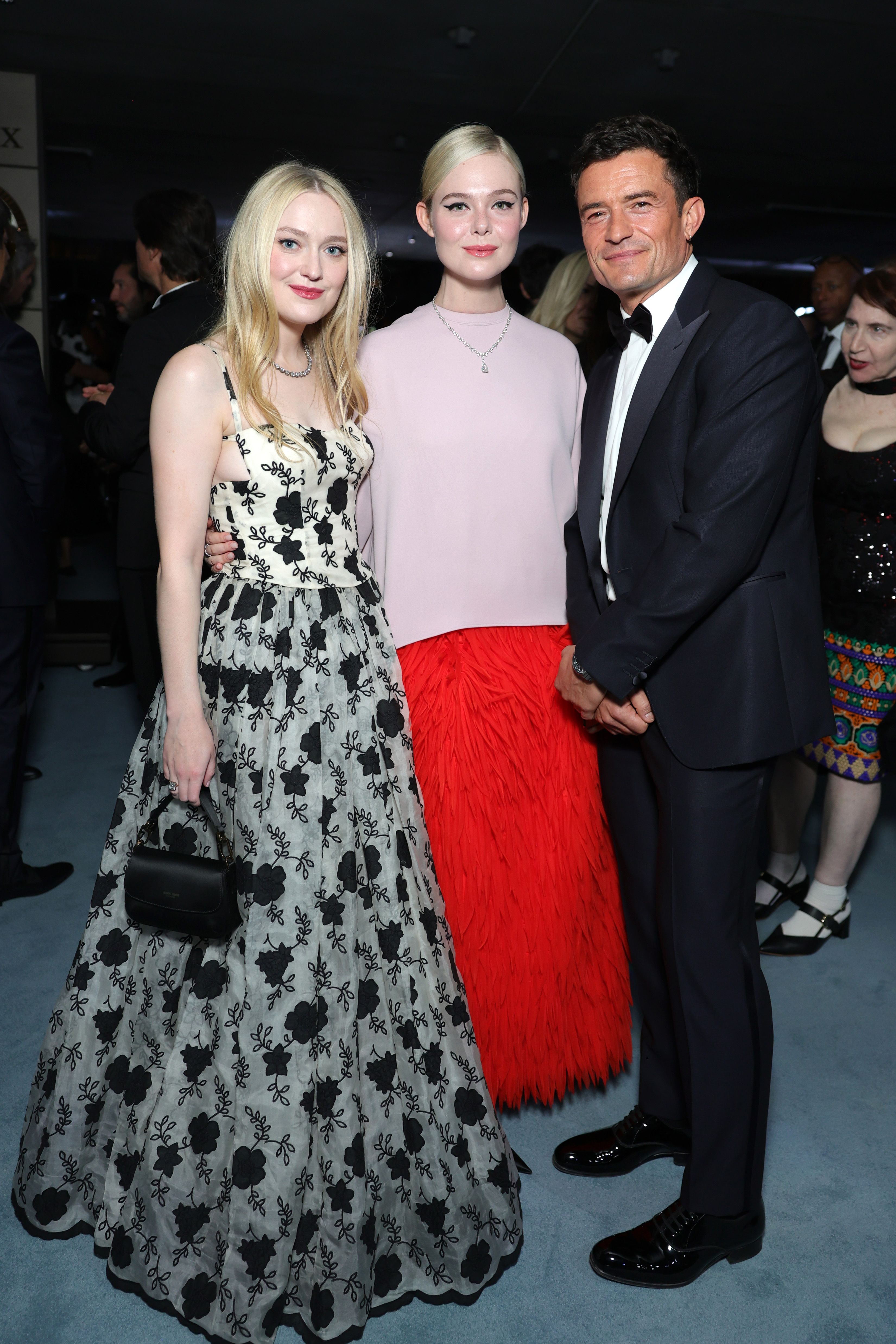 LOS ANGELES, CALIFORNIA - OCTOBER 18: (FOR EDITORIAL USE ONLY) (L-R) Dakota Fanning, Elle Fanning, and Orlando Bloom attend the Academy Museum 5th Annual Gala in Partnership with Rolex at Academy Museum of Motion Pictures on October 18, 2025 in Los Angeles, California. (Photo by Stefanie Keenan/Oscars/Getty Images for  Academy Museum of Motion Pictures)