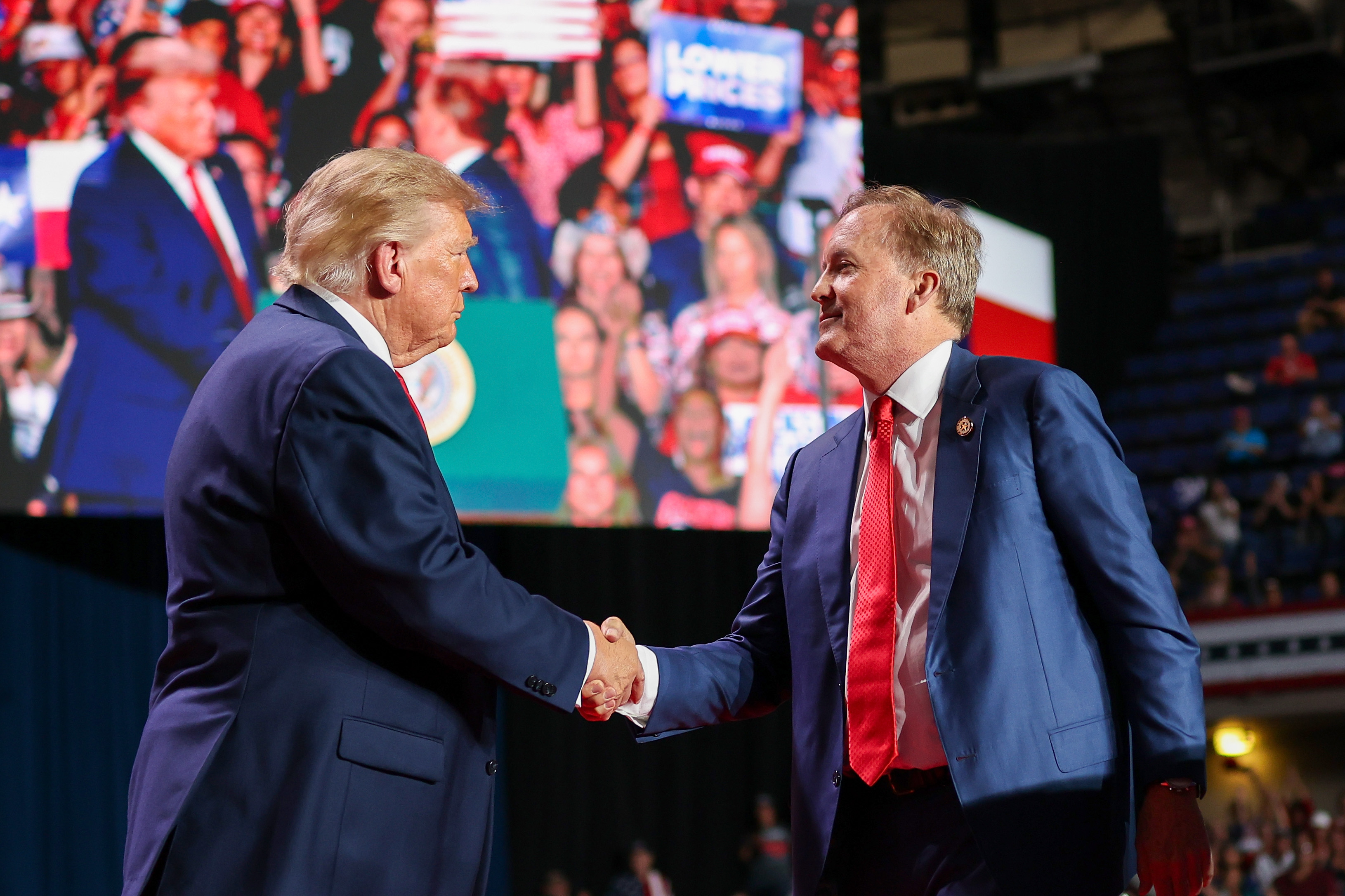 SAN ANTONIO, TEXAS - OCTOBER 07: U.S. President Donald Trump (L) shakes hands with Republican Senate candidate Texas Attorney General Ken Paxton as he brings him on stage during a campaign rally at the Freeman Coliseum on October 07, 2026 in San Antonio, Texas. On his third trip to the state in the last 30 days, Trump is visiting Texas to campaign for Republican candidates, including Senate candidate and Texas Attorney General Ken Paxton, ahead of the midterm elections. (Photo by Win McNamee/Getty Images)