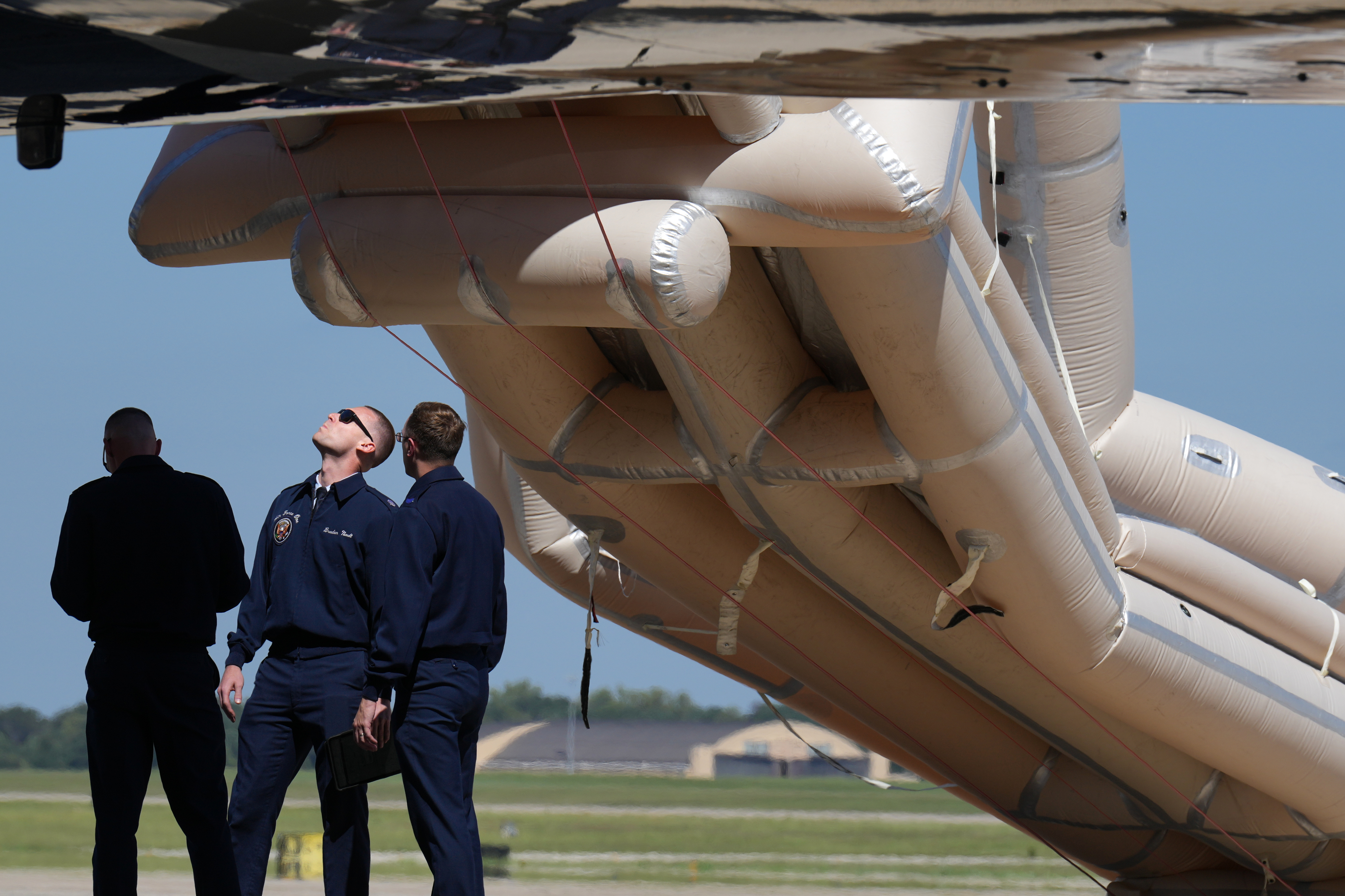 Air Force personnel work after an emergency inflatable slide deployed before President Donald Trump arrived to board at Joint Base Andrews, Md, Wednesday, Sept 9,&nbsp;2026 (AP Photo/Jacquelyn Martin)