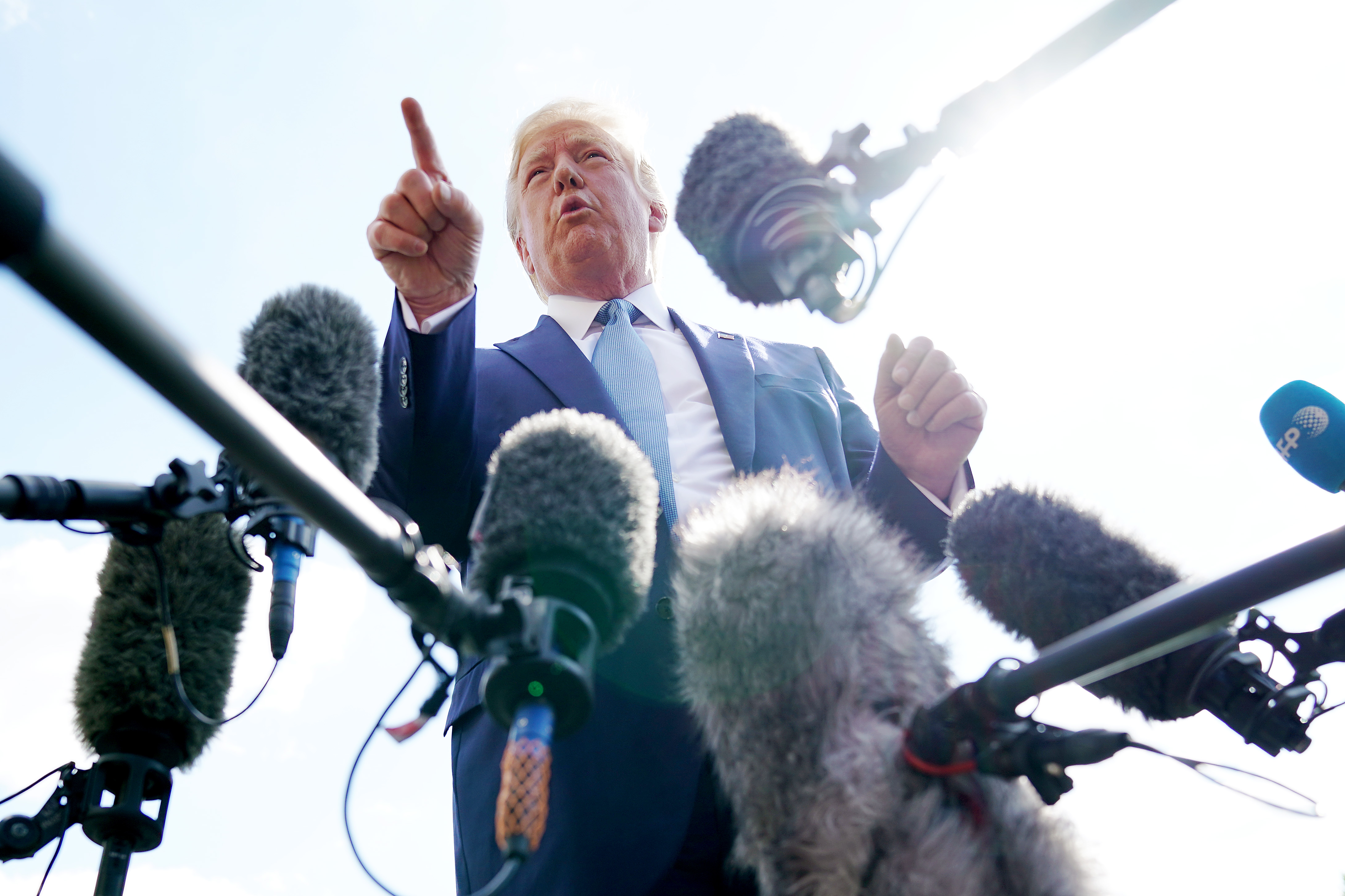 WASHINGTON, DC - OCTOBER 04: U.S. President Donald Trump talks to journalists on the South Lawn of the White House before boarding Marine One and traveling to Walter Reed National Military Medical Center October 04, 2019 in Washington, DC. According to the White House, Trump will be visiting injured military service members. (Photo by Chip Somodevilla/Getty Images)