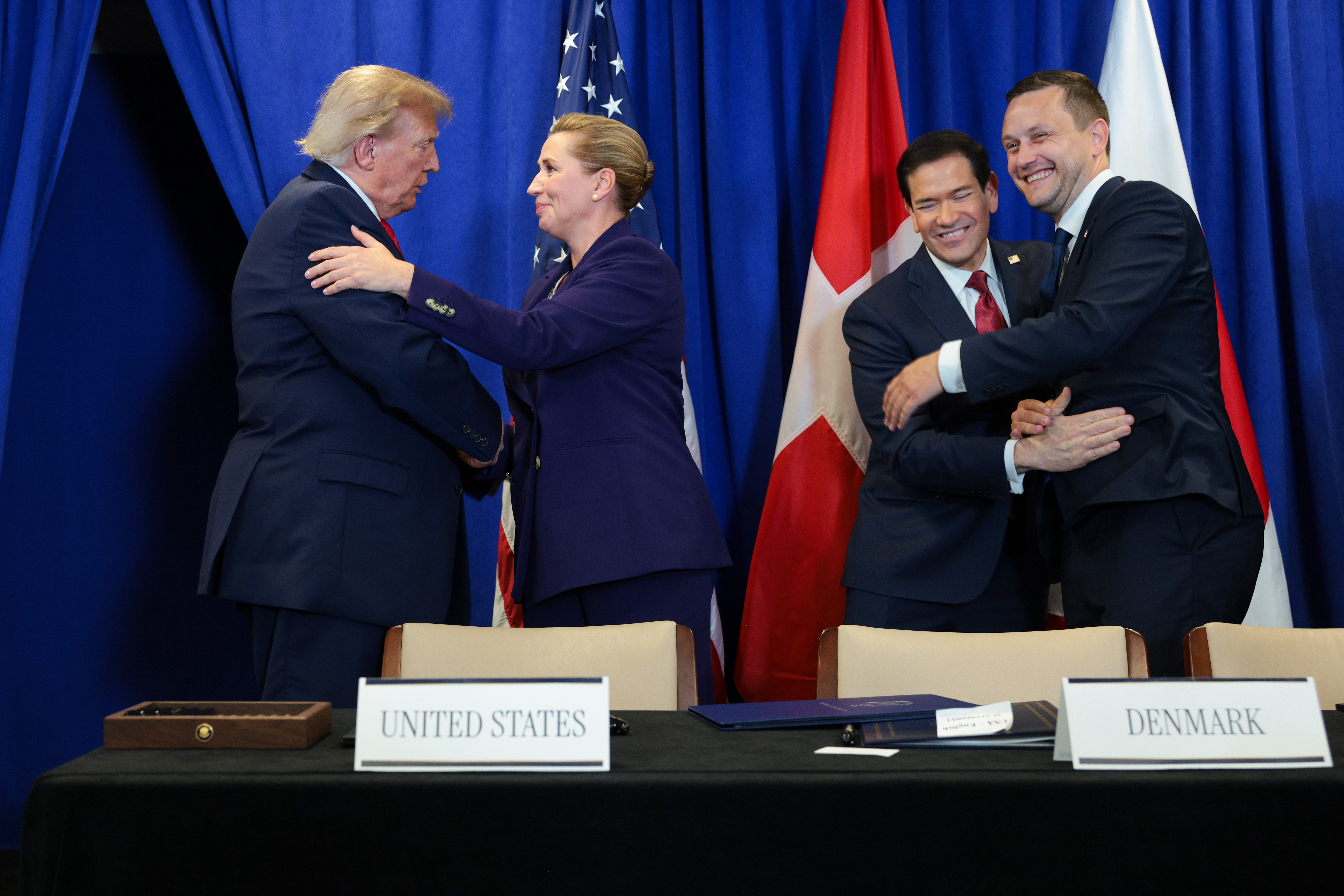 NEW YORK, NEW YORK - SEPTEMBER 22: (L-R) U.S. President Donald Trump, Prime Minister of Denmark Mette Frederiksen, U.S. Secretary of State Marco Rubio and Prime Minister of Greenland Jens-Frederik Nielsen shake hands during the signing of a security pact between the U.S., Denmark, and Greenland during the 81st session of the United Nations (U.N.) General Assembly at U.N. Headquarters on September 22, 2026 in New York City. World leaders have gathered in New York for the annual session of the United Nations General Assembly, with this year's global issues ranging from the threat of artificial intelligence to the continued wars in Ukraine and Gaza. (Photo by Chip Somodevilla/Getty Images)