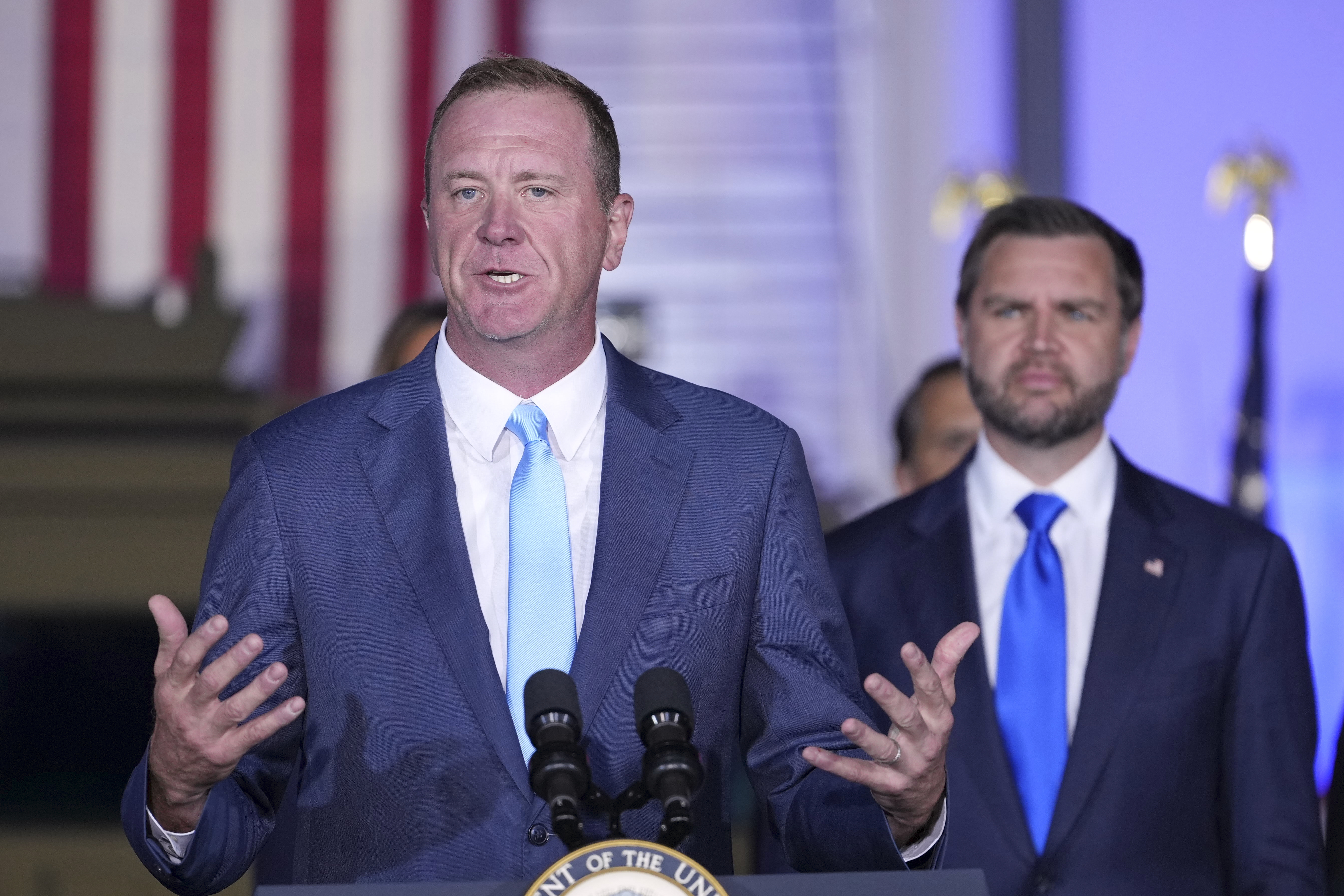 KANSAS CITY, MISSOURI - SEPTEMBER 14: Sen. Eric Schmitt, R-Mo., speaks as Vice President JD Vance listens during an event at the FBI Field Office  on September 14, 2026 in Kansas City, Missouri. Vance is visiting Missouri and Kansas on a Midwest trip. (Photo by Mark Schiefelbein-Pool/Getty Images)