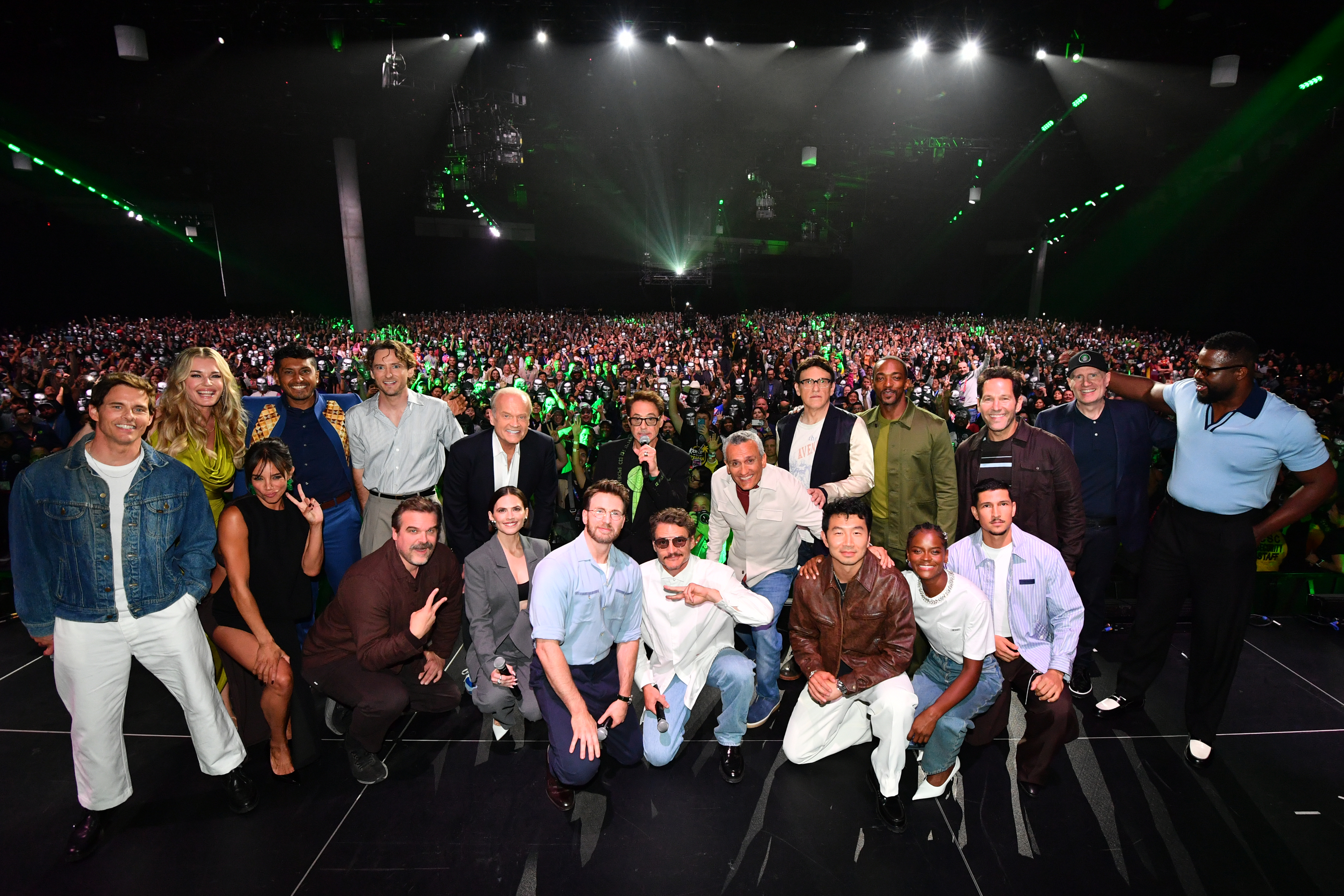 SAN DIEGO, CALIFORNIA - JULY 25: (L-R) James Marsden, Rebecca Romijn, Hannah John-Kamen, Tenoch Huerta, Lewis Pullman, David Harbour, Kelsey Grammer, Hayley Atwell, Chris Evans, Robert Downey Jr., Pedro Pascal, Joe Russo, Anthony Russo, Simu Liu, Anthony Mackie, Letitia Wright, Danny Ramirez, Paul Rudd, Kevin Feige, President, Marvel Studios and Winston Duke pose onstage during the Marvel Studios Panel at 2026 San Diego Comic-Con on July 25, 2026 in San Diego, California. (Photo by Alberto E. Rodriguez/Getty Images for Disney)