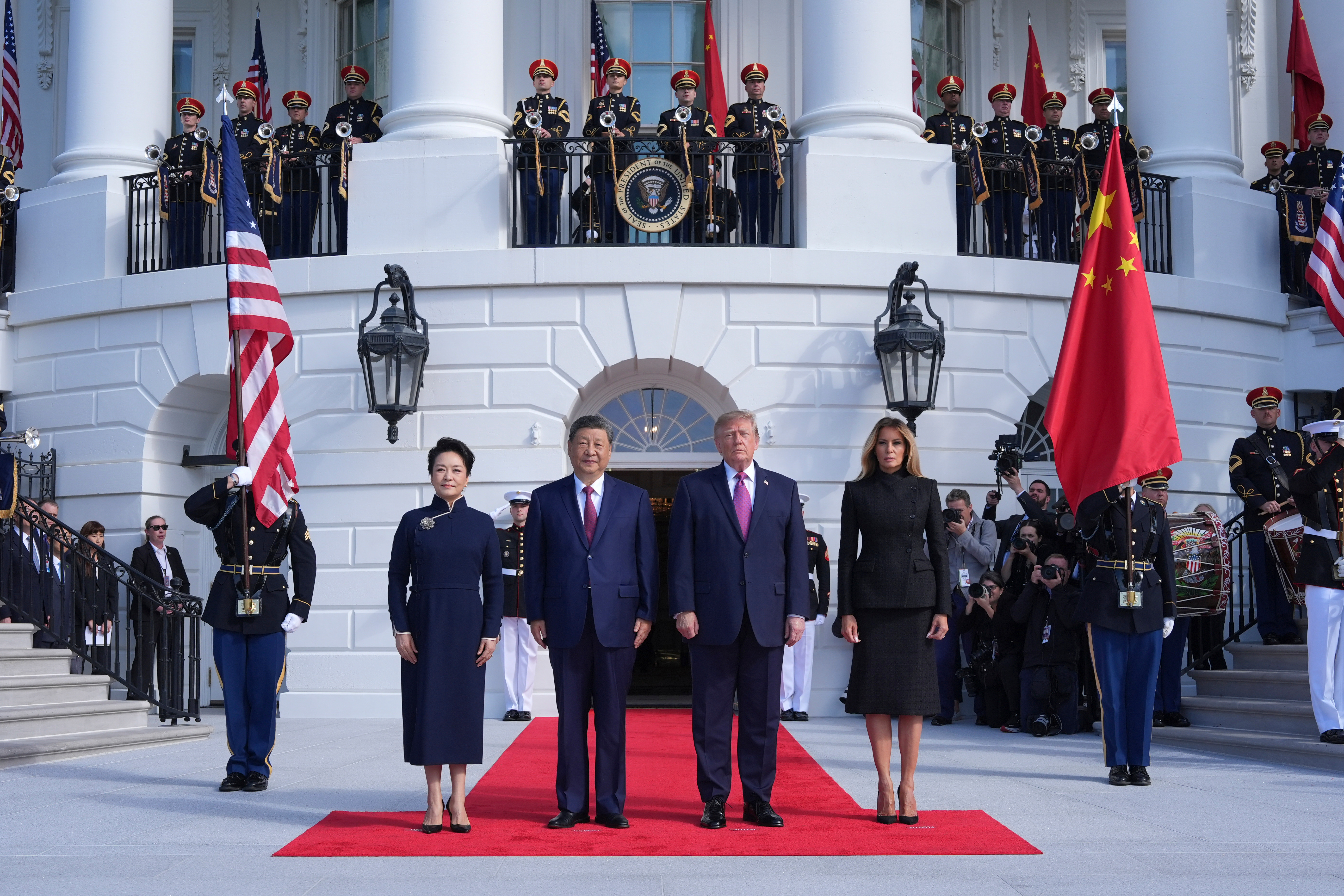 President Donald Trump, center right, and first lady Melania Trump, right, greet China's President Xi Jinping, center left, and his wife Peng Liyuan on the South Portico of the White House, Thursday, Sept. 24, 2026, in Washington. (AP Photo/Alex Brandon)