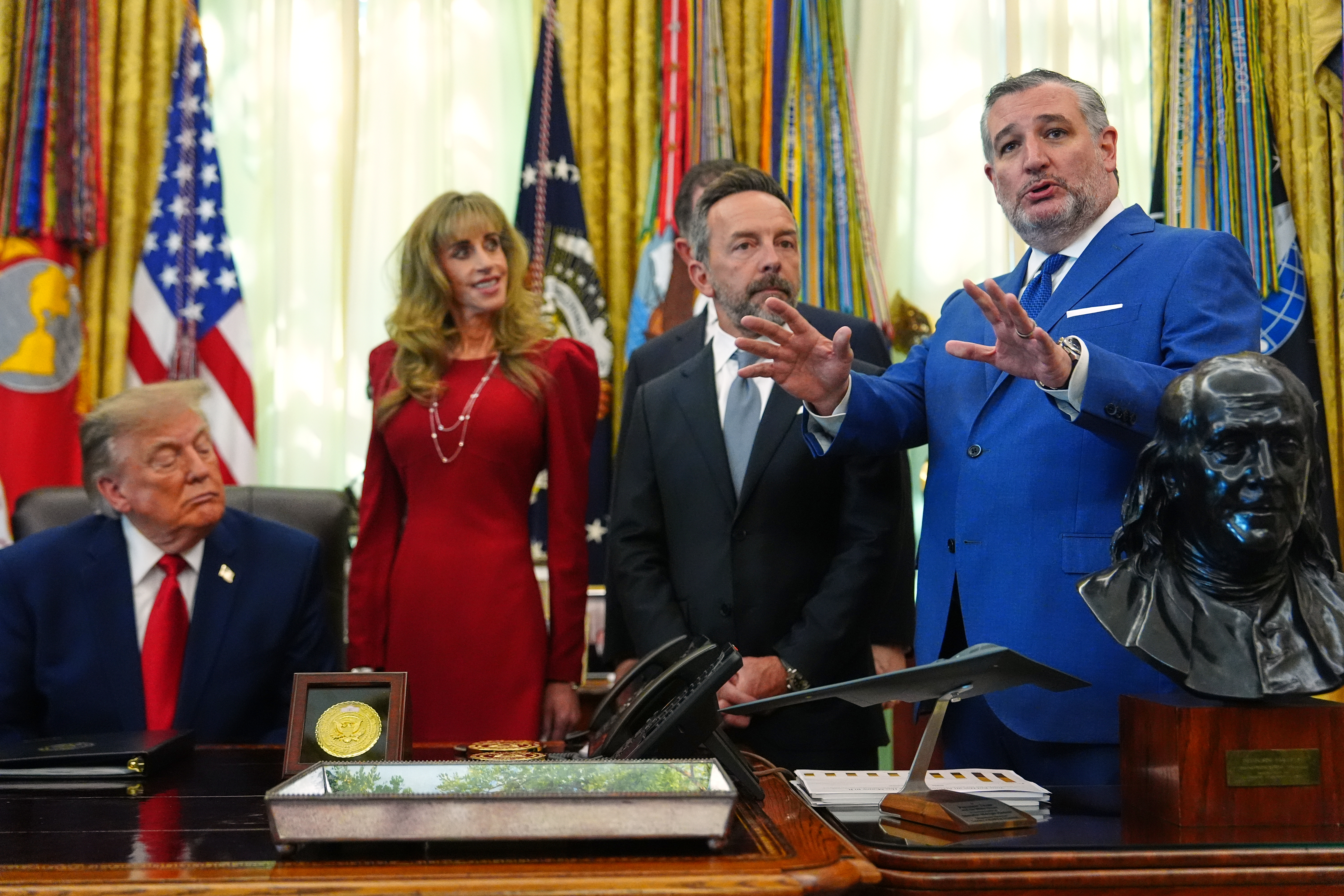 President Donald Trump, Susan Dell and Brad Gerstner listen as Sen. Ted Cruz, R-Texas, speaks in the Oval Office of the White House, Wednesday, Oct. 7, 2026, in Washington. (AP Photo/Julia Demaree Nikhinson)