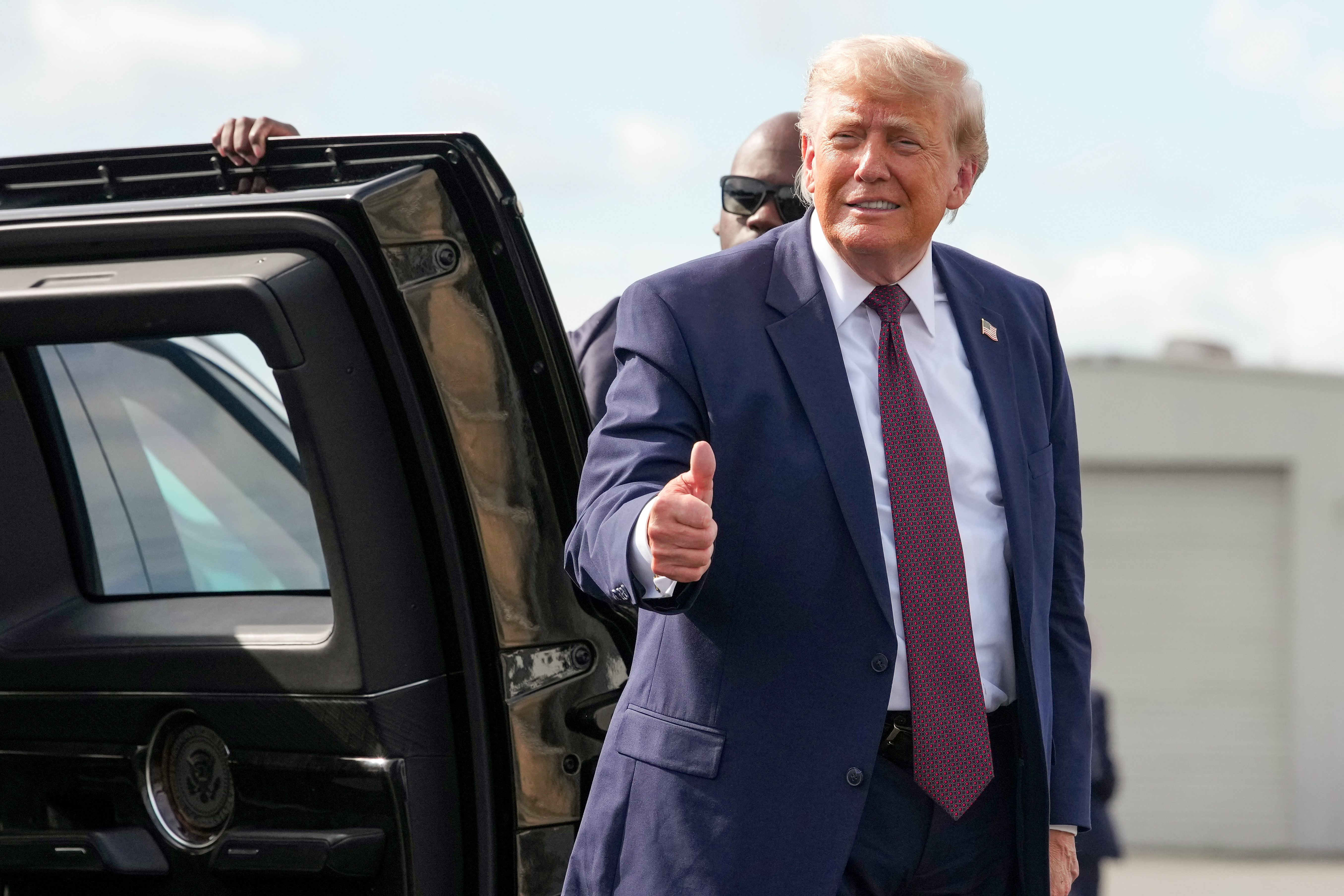 READING, PENNSYLVANIA - JUNE 23: U.S. President Donald Trump gestures to the media as he walks to board Air Force One while departing Reading Regional Airport on June 23, 2026 in Reading, Pennsylvania. President Trump traveled to Pennsylvania to deliver remarks at a Mack Trucks facility. (Photo by Andrew Harnik/Getty Images)