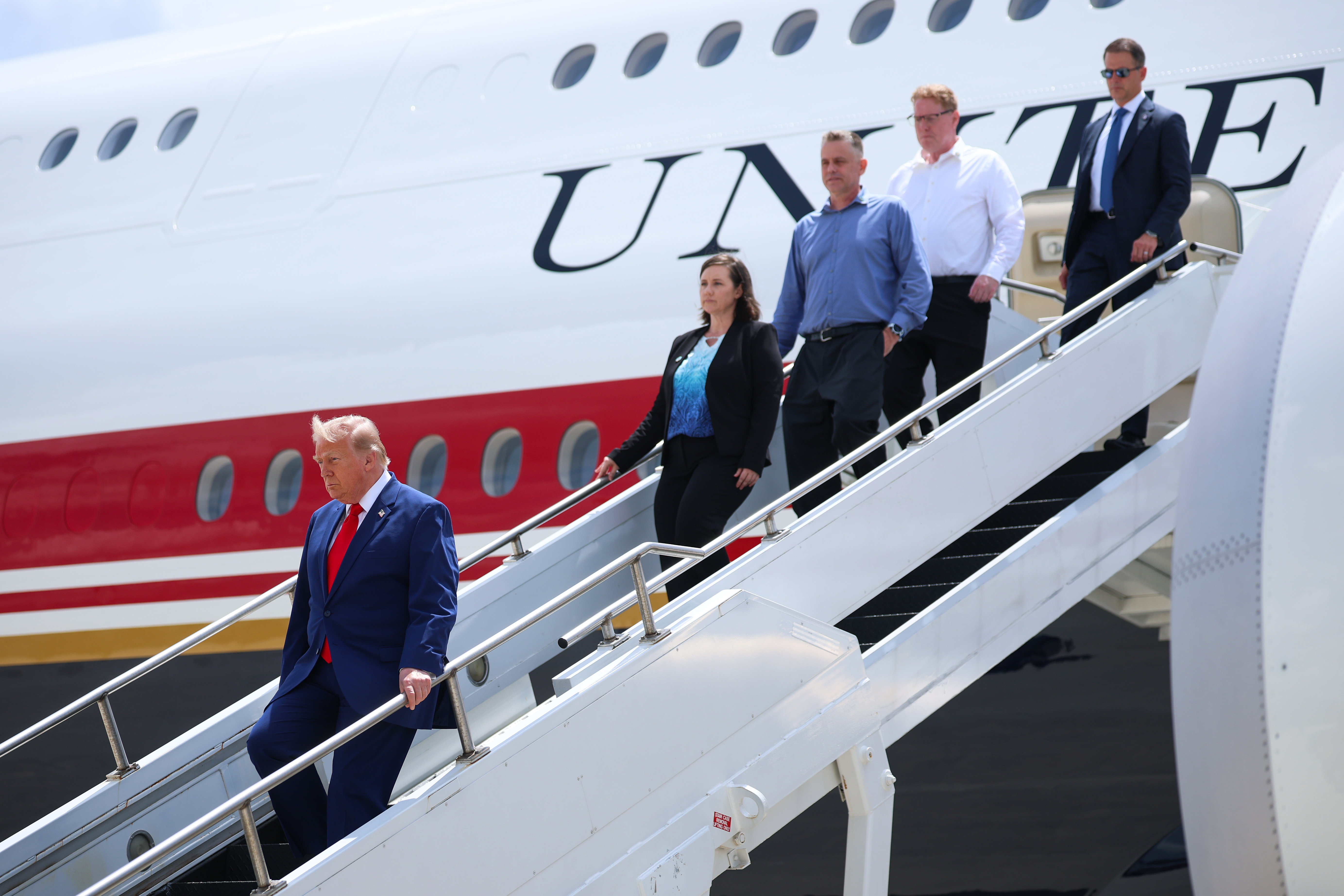 The family of Army 1st Lt. Tyler James Feehan depart Air Force One with U.S. President Donald Trump at Dobbins Air Reserve Base as they accompany him to Georgia following Feehan's dignified...