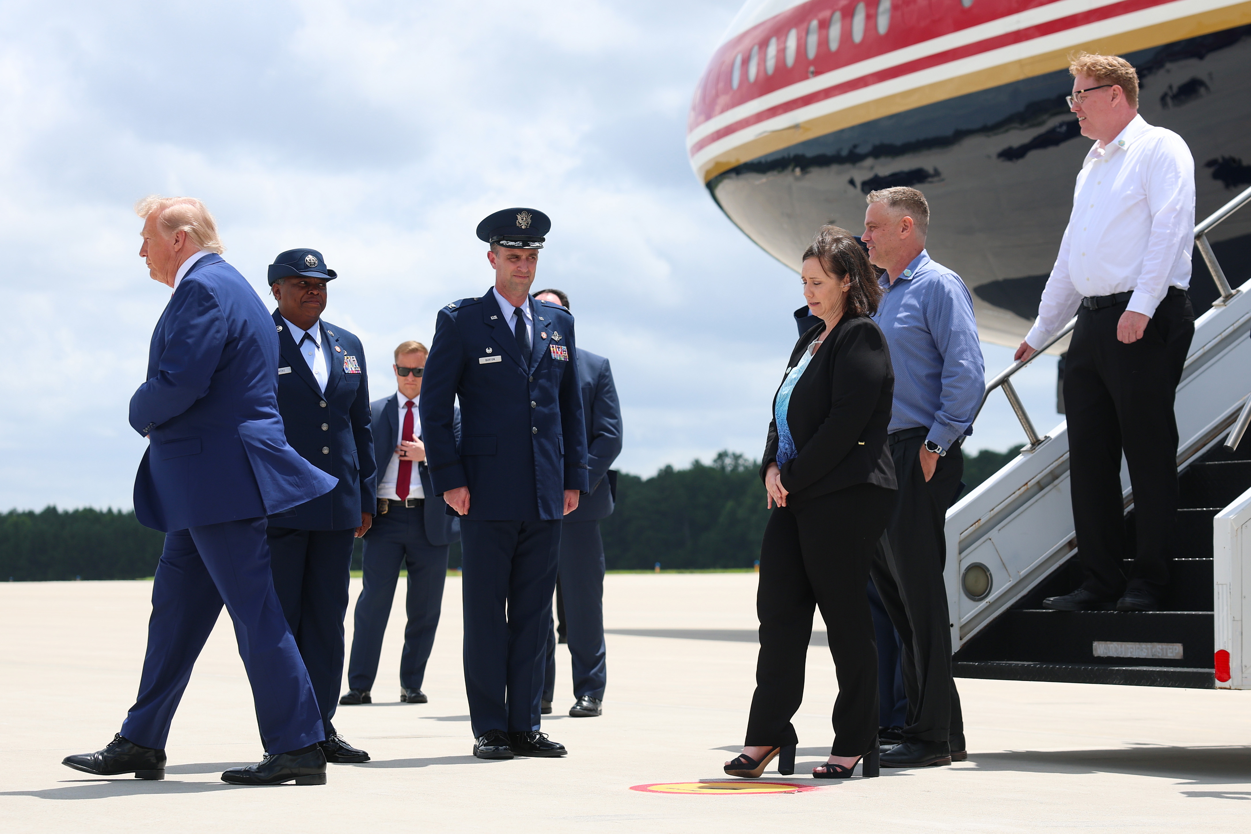 The family of Army 1st Lt. Tyler James Feehan depart Air Force One with U.S. President Donald Trump at Dobbins Air Reserve Base as they accompany him to Georgia following Feehan's dignified...