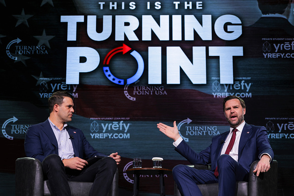 ATHENS, GEORGIA - APRIL 14:  U.S. Vice President JD Vance (R) speaks with Turning Point USA spokesperson Andrew Kolvet during a Turning Point USA event at Akins Ford Arena at the Classic Center on April 14, 2026 in Athens, Georgia. Vice President Vance has continued to support TPUSA and its mission following the 2025 murder of the conservative student organization's founder and leader, far-right activist Charlie Kirk. (Photo by Chip Somodevilla/Getty Images)