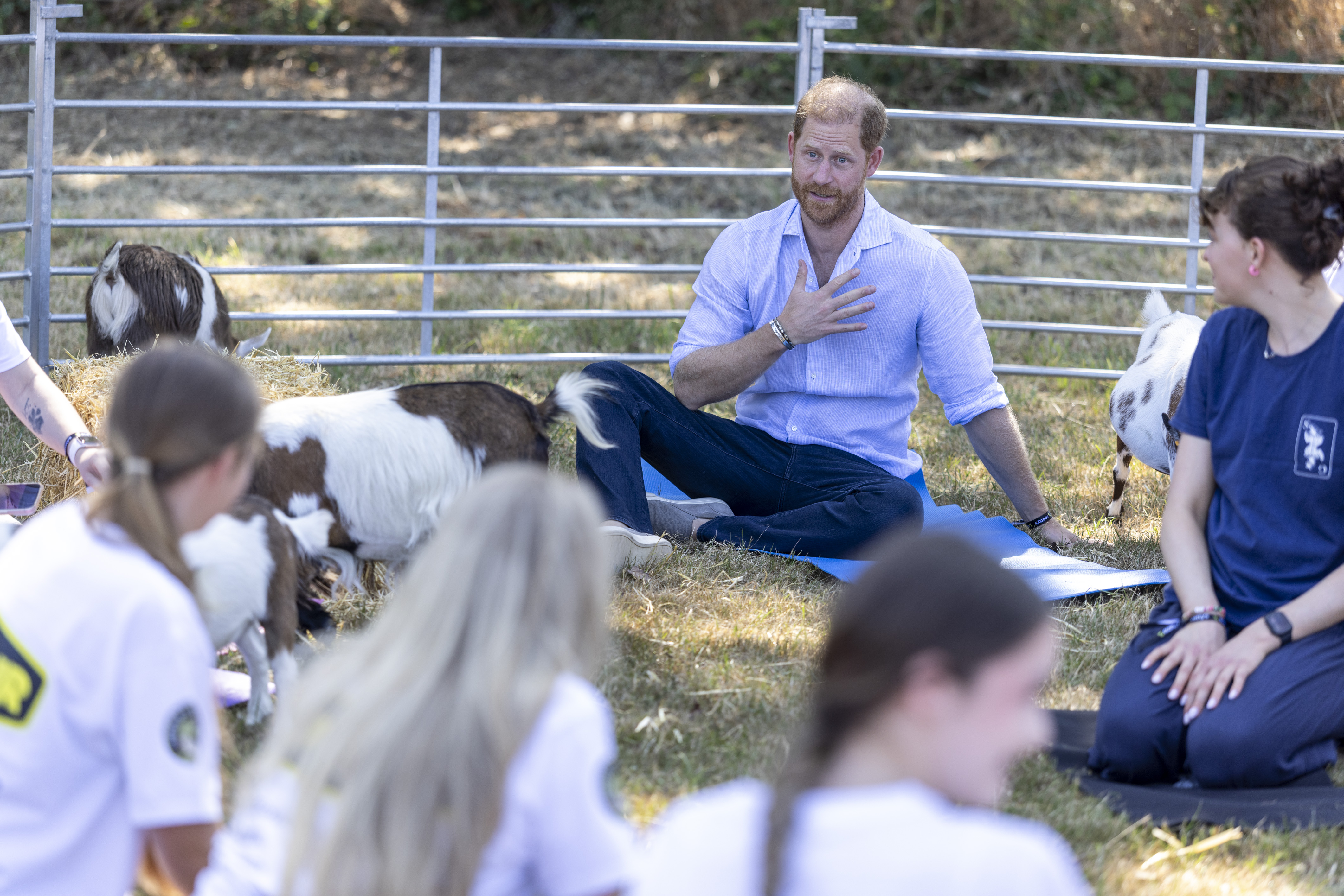 BIRMINGHAM, ENGLAND - JULY 11:  Prince Harry, Duke of Sussex takes part in Goat Yoga during Scotty's Summer Festival at Maxstoke Castle on July 11, 2026 in Birmingham, England. Scotty's is a military bereavement charity that provides relief from the effects of grief for bereaved military children and young people who have experienced the death of a parent who served in the British Forces.  (Photo by Heathcliff O'Malley-Pool/Getty Images)