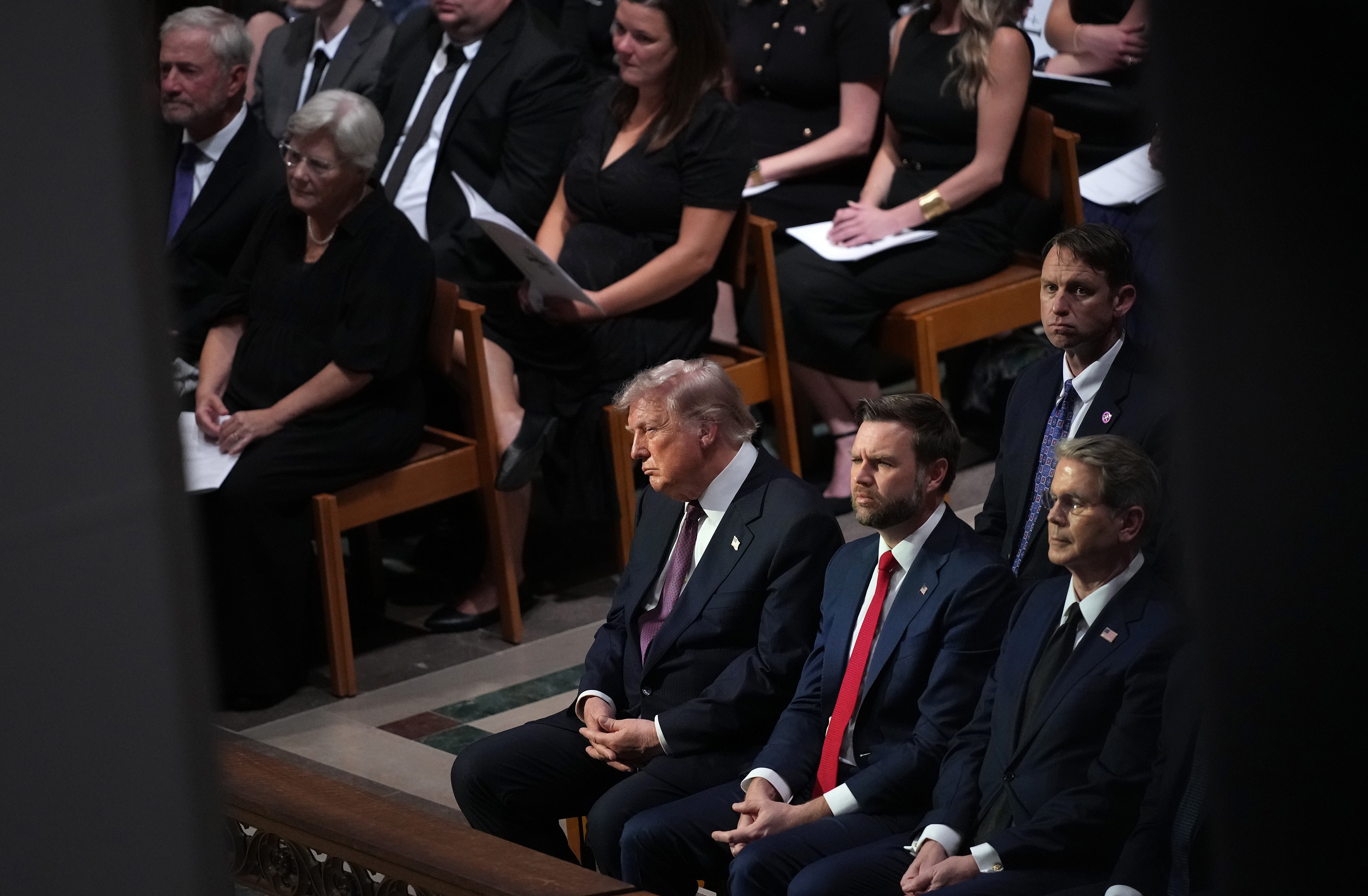 President Donald Trump (L) and U.S. Vice President JD Vance (C) and U.S. Treasury Secretary Scott Bessent look on during the funeral service for the late U.S. Sen. Lindsey Graham (R-SC) at the Washington National Cathedral on July 28, 2026 in Washington, DC.( Andrew Harnik/Getty Images)