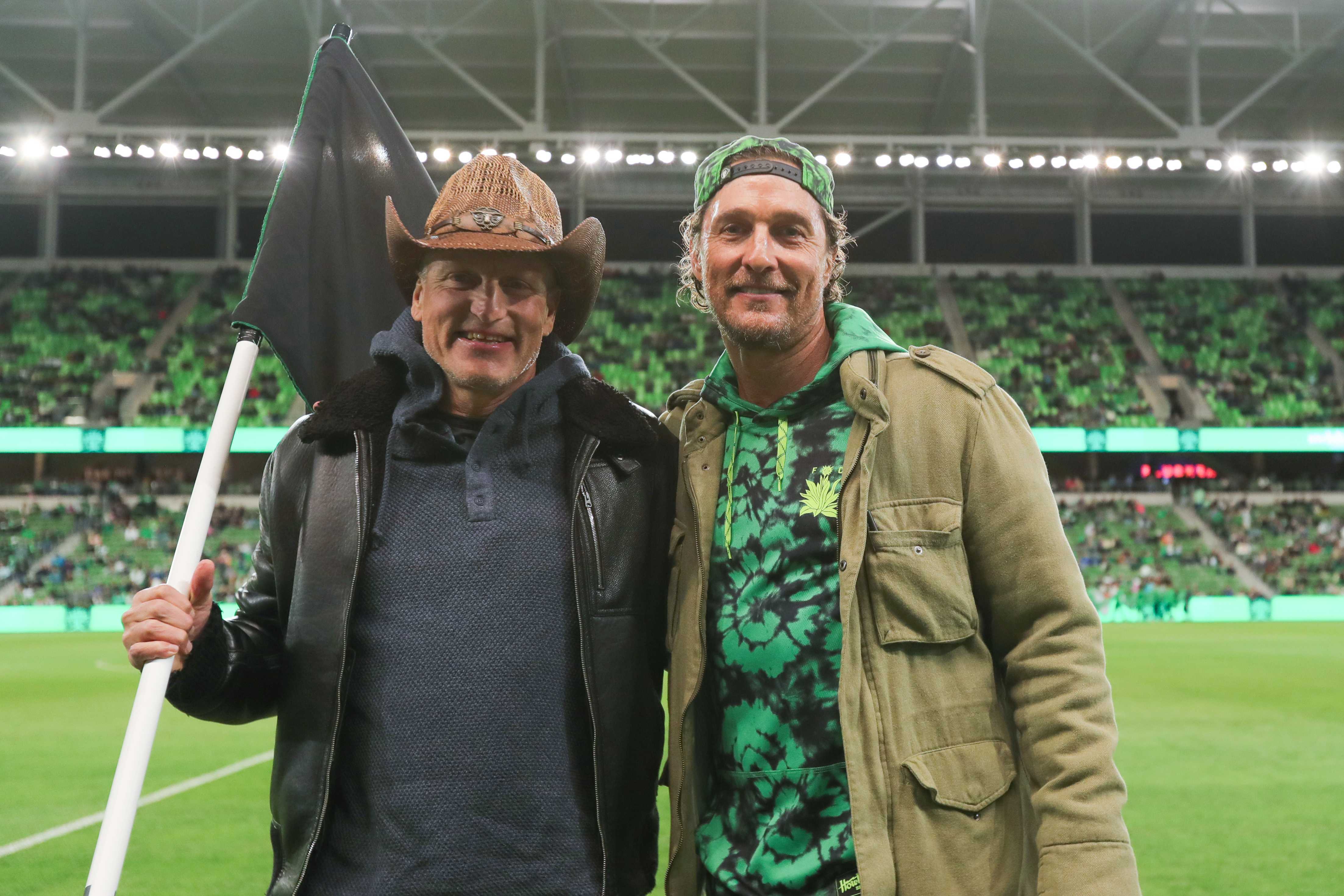 Woody Harrelson and Matthew McConaughey pose for picture during the MLS match between Austin FC and Colorado Rapids at Q2 Stadium on March 8, 2025 in Austin, Texas.
