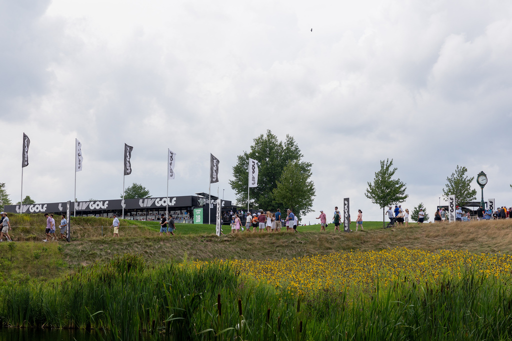Fans walk along a path during the third round of LIV Golf Bedminster at Trump National Golf Club, Saturday, Aug. 8, 2026, in Bedminster, N.J. (Elise LeBlanc/LIV Golf via AP)