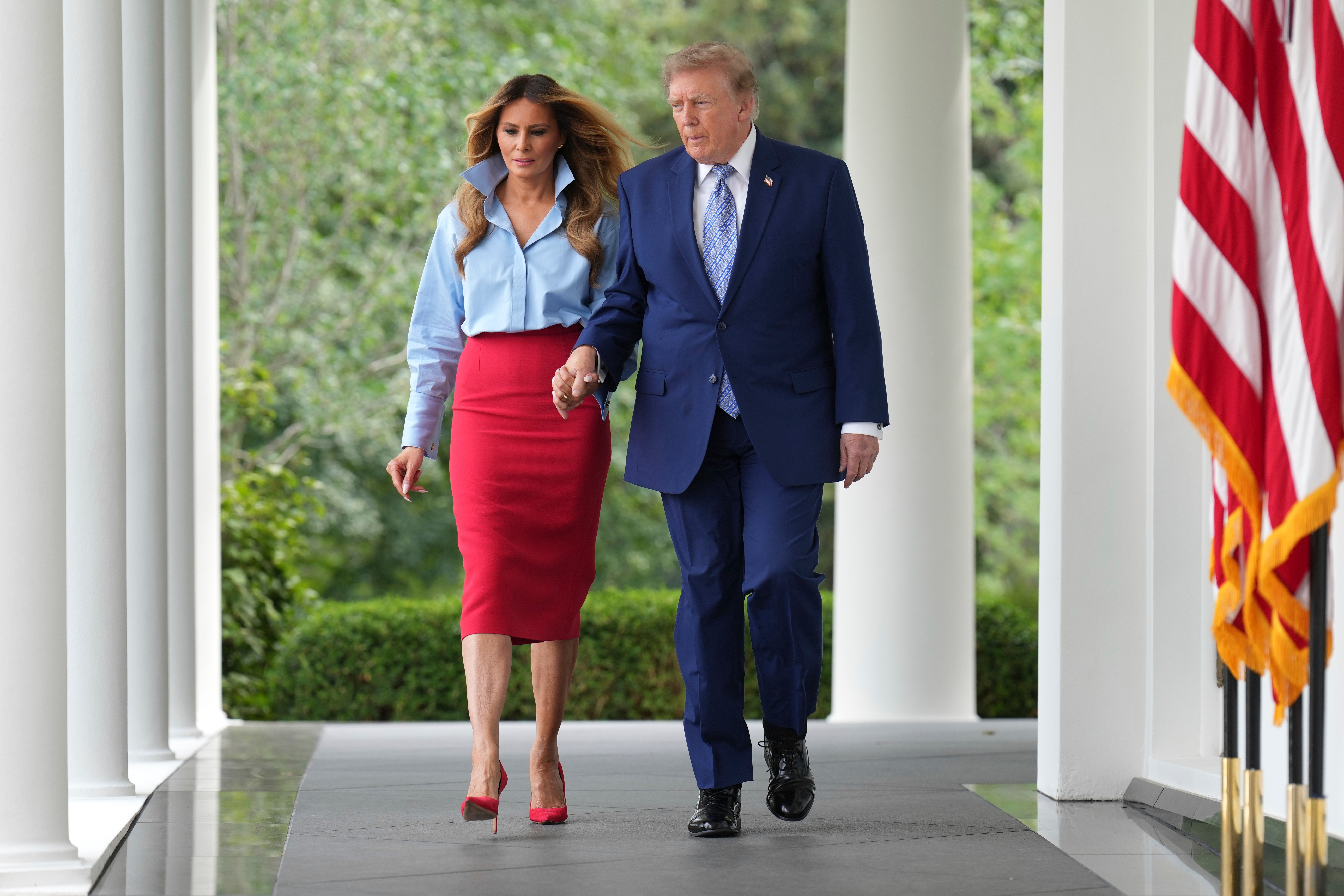 President Donald Trump, right, and first lady Melania Trump walk to attend an event in the Rose Garden of the White House, Thursday, Aug. 20, 2026, in Washington. (AP Photo/Jacquelyn Martin)