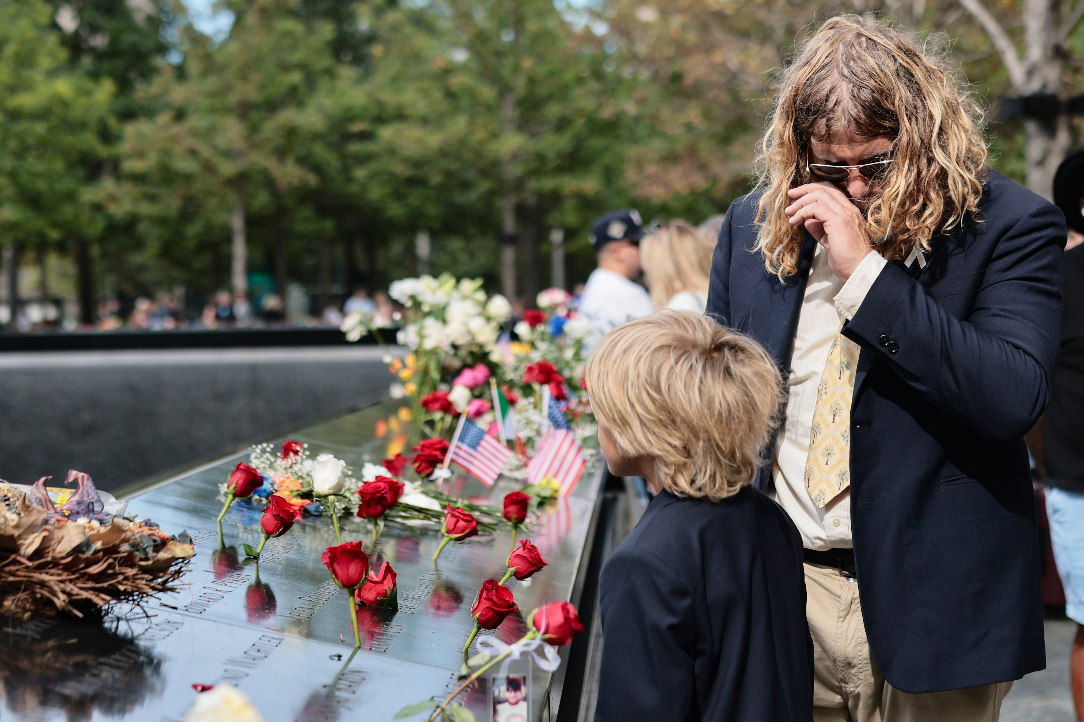 NEW YORK, NEW YORK - SEPTEMBER 11: People visit the memorial during a ceremony commemorating the 25th anniversary of the September 11th terrorist attacks on the World Trade Center at the National 9/11 Memorial & Museum on September 11, 2026 in New York City. The United States is marking the 25th anniversary of the terrorist attacks of September 11, 2001, when a group of al-Qaeda hijackers flew airplanes into the World Trade Center, Shanksville, Pennsylvania, and the Pentagon, killing nearly 3,000 people. (Photo by Michael M. Santiago/Getty Images)