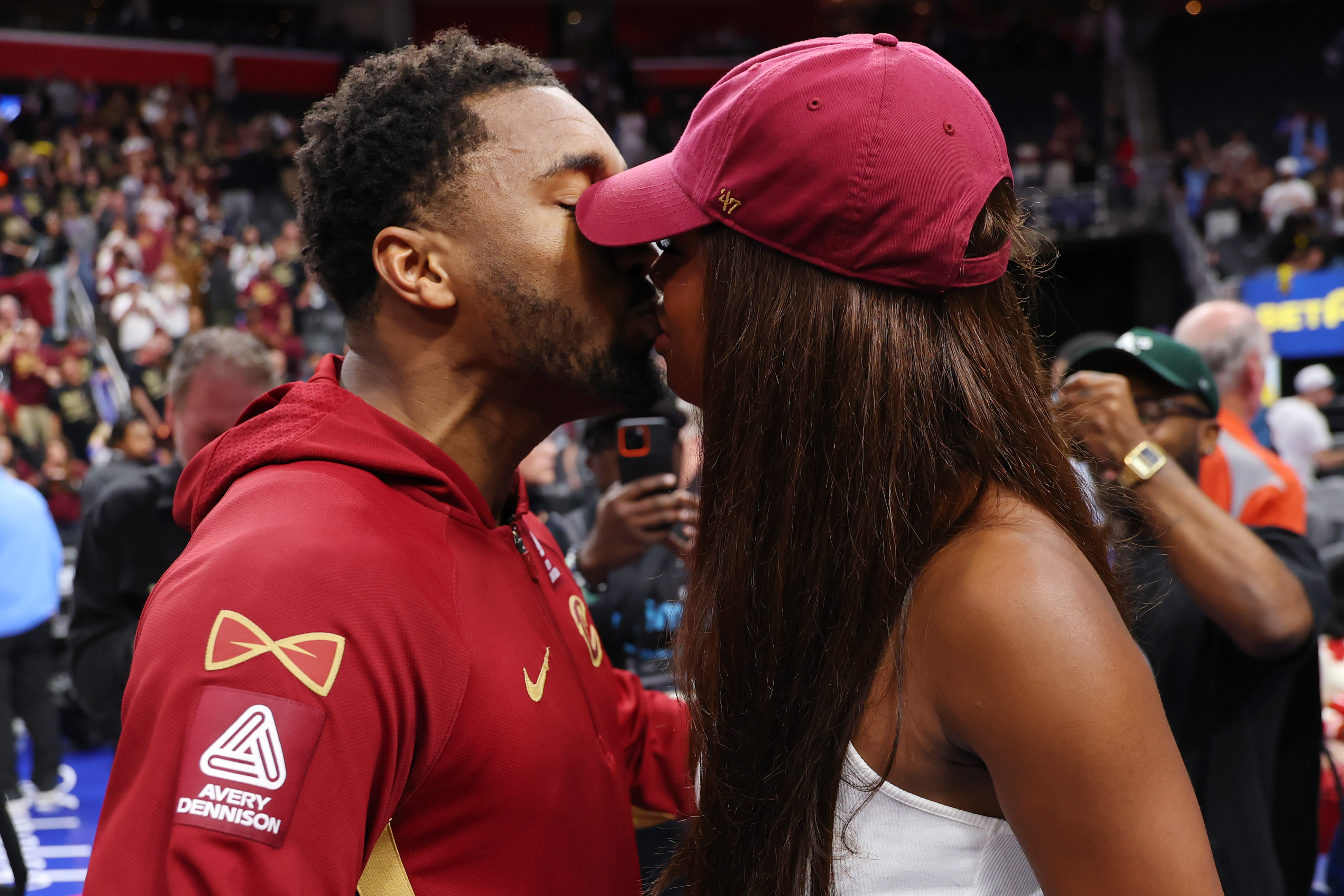 DETROIT, MICHIGAN - MAY 17: Donovan Mitchell #45 of the Cleveland Cavaliers and fiancee Coco Jones kiss after Game Seven of the Second Round of the NBA Eastern Conference Playoffs at Little Caesars Arena on May 17, 2026 in Detroit, Michigan. NOTE TO USER: User expressly acknowledges and agrees that, by downloading and or using this photograph, User is consenting to the terms and conditions of the Getty Images License Agreement. (Photo by Gregory Shamus/Getty Images)