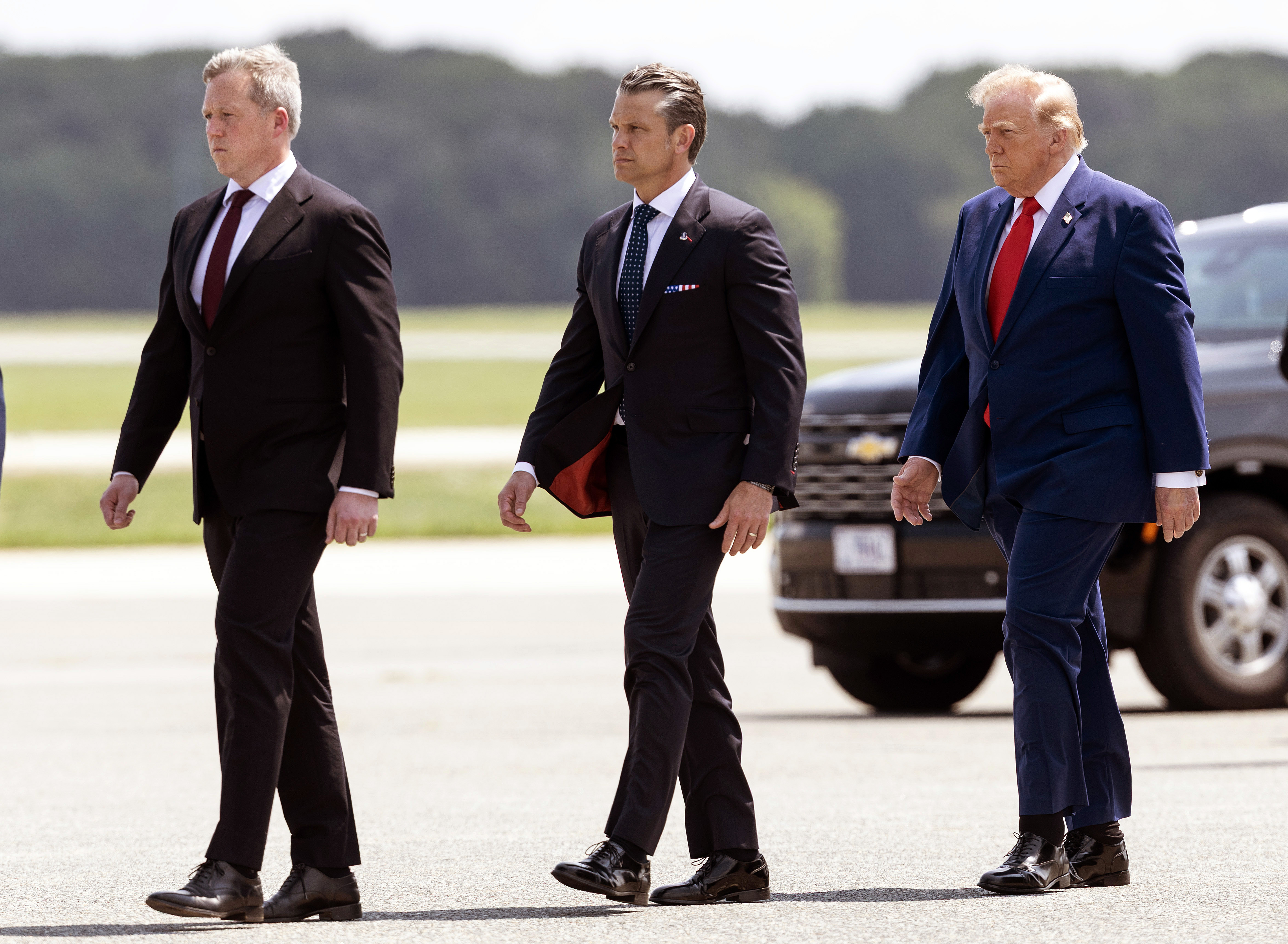 DOVER, DELAWARE - JULY 22: (L-R) U.S. Secretary of the Army Dan Driscoll, Secretary of War Pete Hegseth and U.S. President Donald Trump attend a dignified transfer at Dover Air Force Base for military casualties of the war with Iran on July 22, 2026 in Dover, Delaware. Army Secretary Dan Driscoll is stepping down from his post following weeks of tension with Hegseth, according to reports. (Photo by Kevin Dietsch/Getty Images)