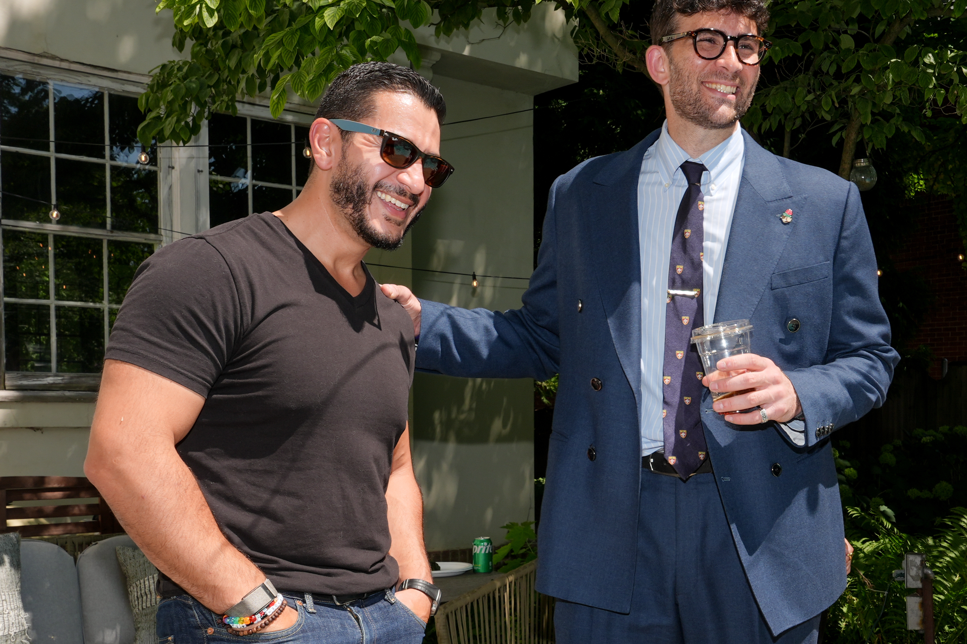 Abdul El-Sayed, a progressive candidate in the Democratic primary for U.S. Senate in Michigan, talks poolside with streamer Hasan Piker at a party for content creators supporting his campaign, Monday, Aug. 3, 2026, in Detroit. (AP Photo/Julia Demaree Nikhinson)