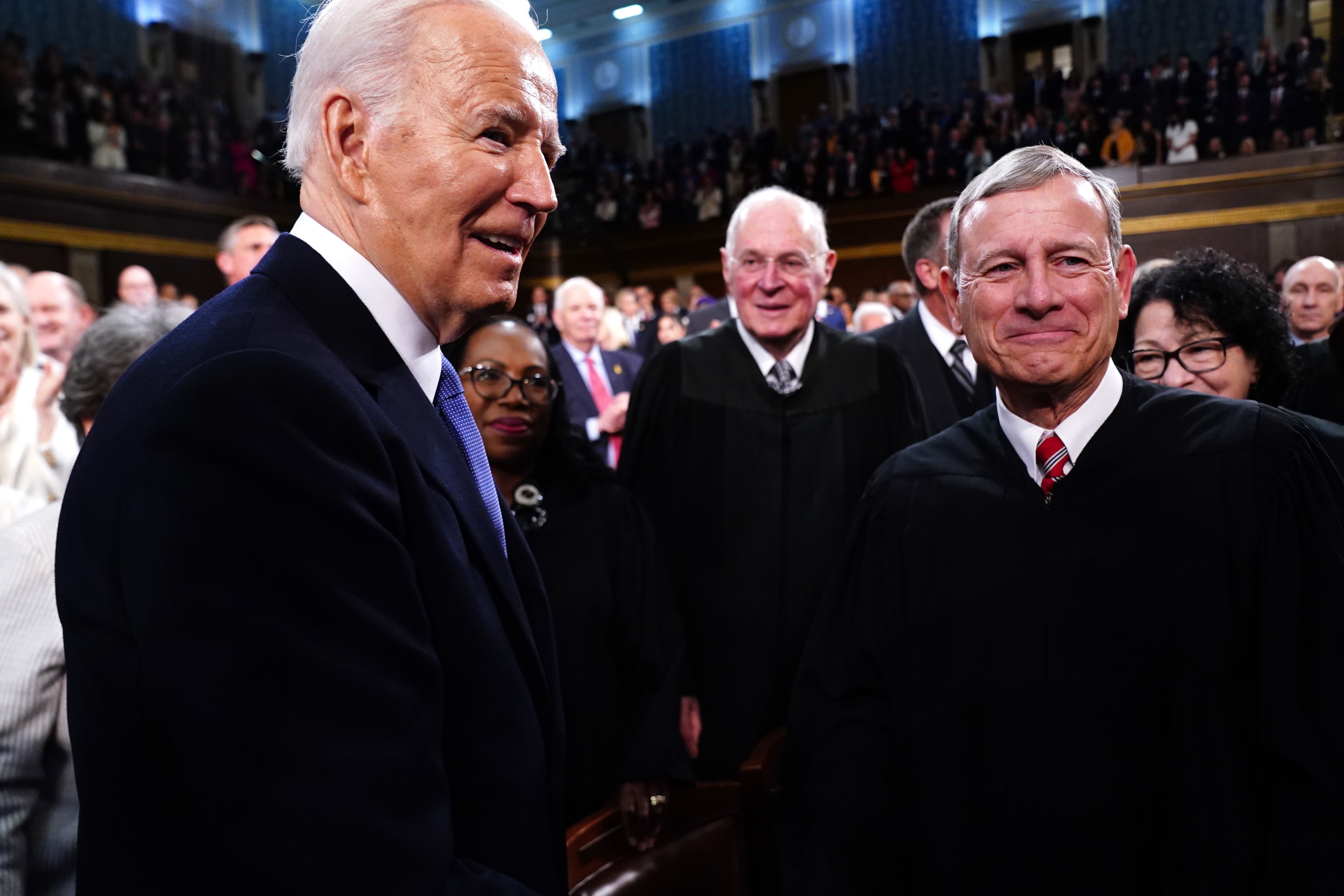 Former President Joe Biden greets Supreme Court Chief Justice John Roberts as Biden enters the House chamber to deliver the annual State of the Union address before a joint session of Congress at the Capital building on March 7, 2024 in Washington, DC (Photo by Shawn Thew-Pool/Getty Images)