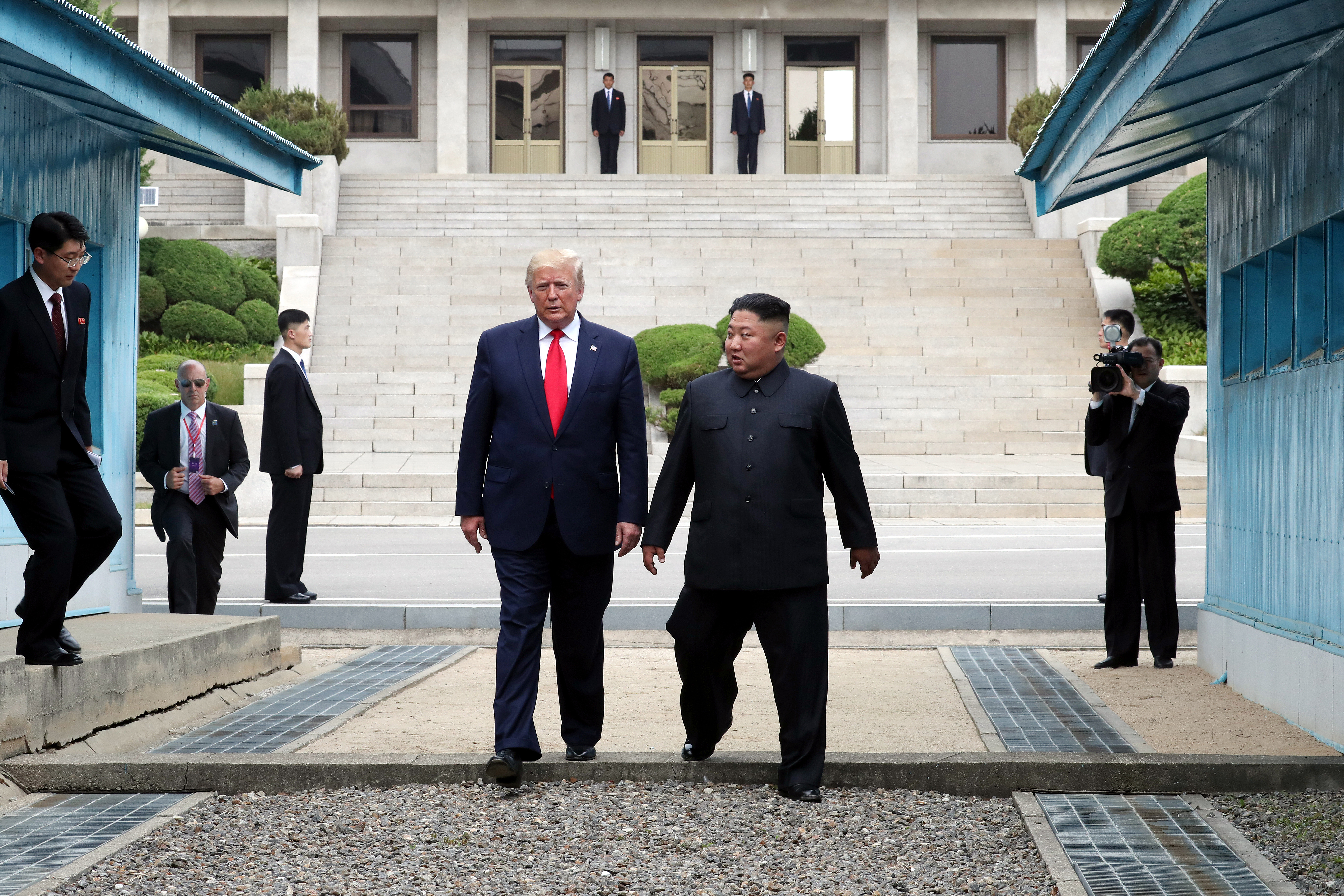 PANMUNJOM, SOUTH KOREA - JUNE 30: (SOUTH KOREA OUT): A handout photo provided by Dong-A Ilbo of North Korean leader Kim Jong Un and U.S. President Donald Trump inside the demilitarized zone (DMZ) separating the South and North Korea on June 30, 2019 in Panmunjom, South Korea. U.S. President Donald Trump and North Korean leader Kim Jong-un briefly met at the Korean demilitarized zone (DMZ) on Sunday, with an intention to revitalize stalled nuclear talks and demonstrate the friendship between both countries. The encounter was the third time Trump and Kim have gotten together in person as both leaders have said they are committed to the