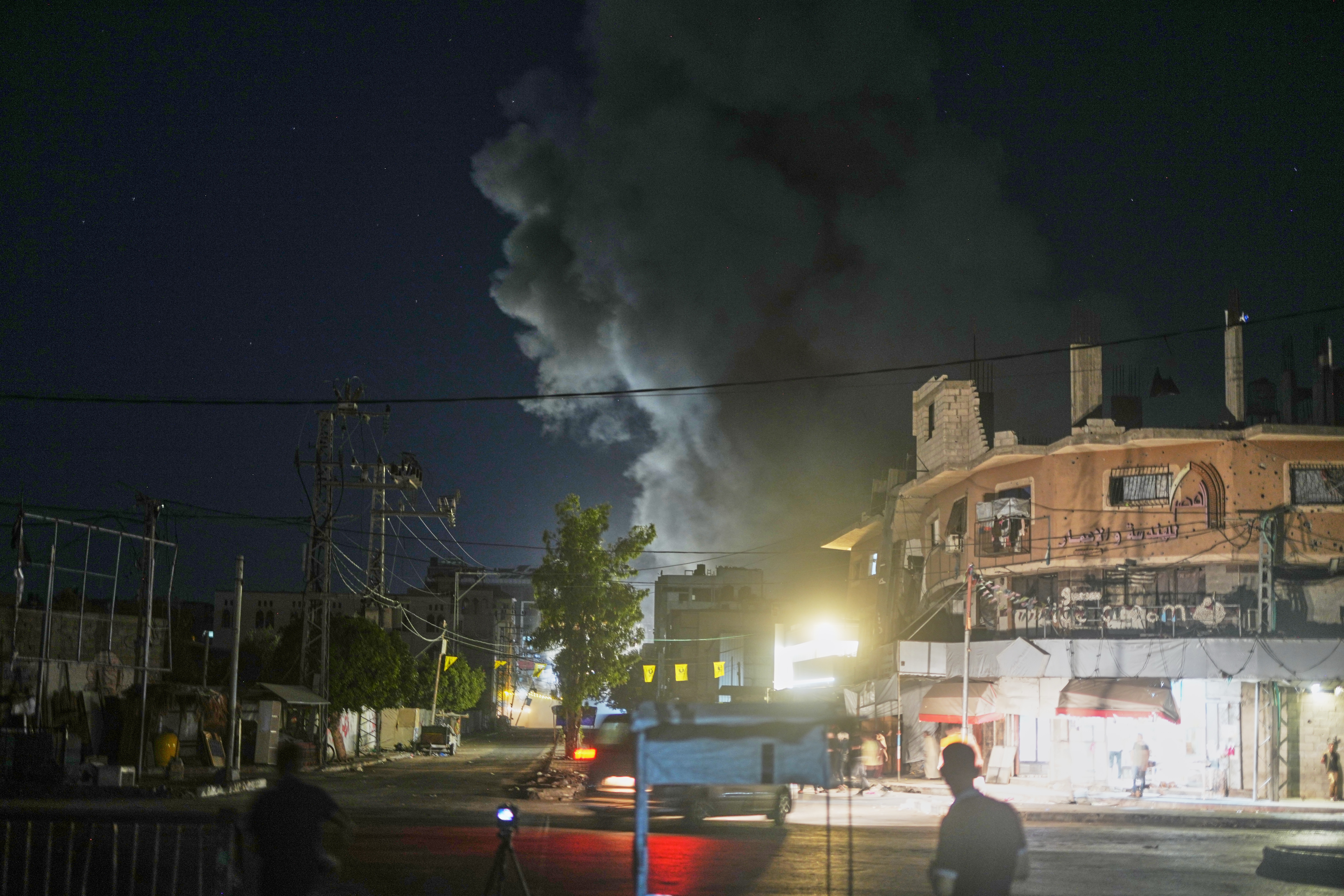 A plume of smoke rises following an Israeli military strike in Nuseirat, central Gaza Strip, Friday, July 31, 2026. (AP Photo/Abdel Kareem Hana)