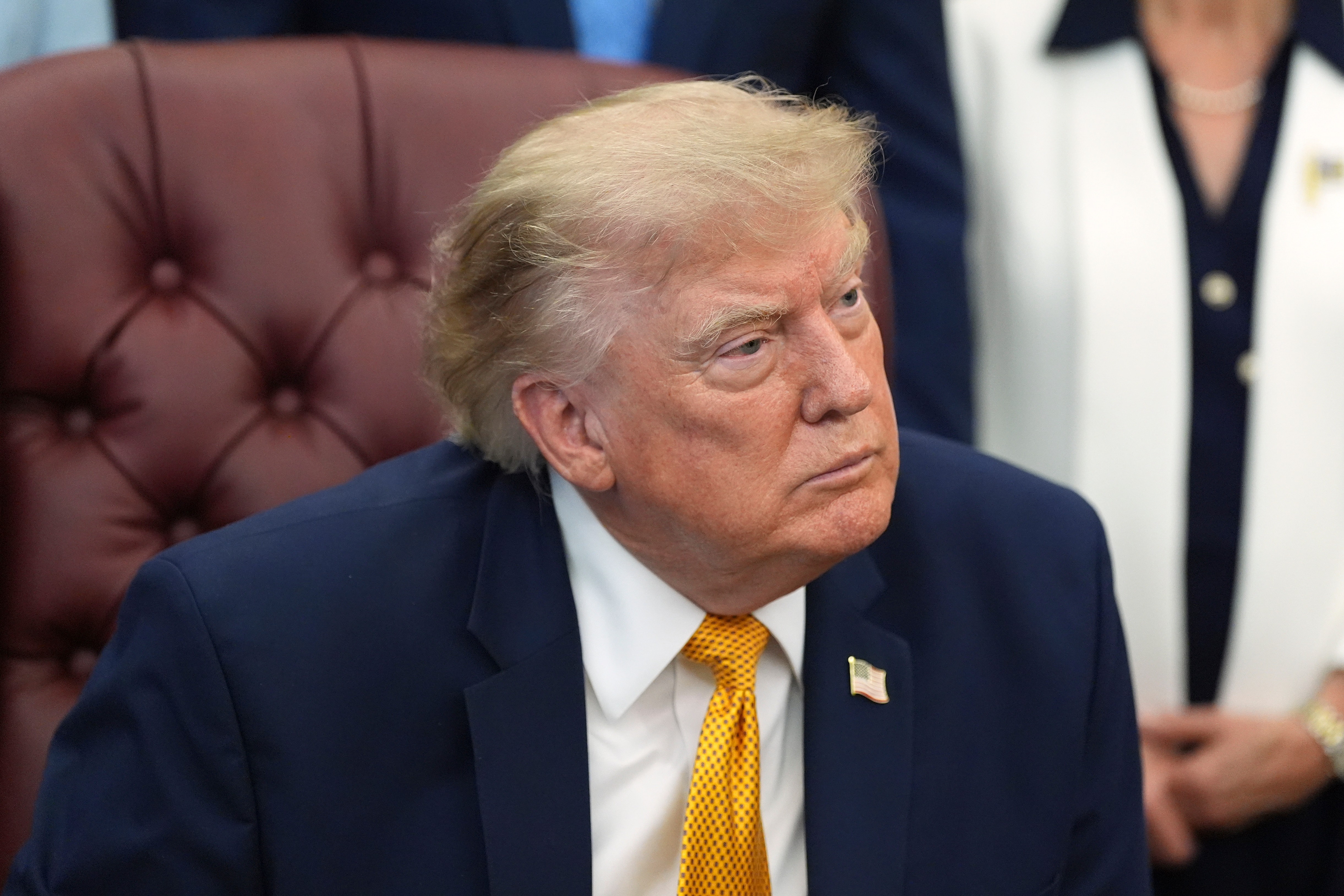 President Donald Trump listens during a meeting about military families, in the Oval Office of the White House, Monday, Aug. 3, 2026, in Washington. (AP Photo/Alex Brandon)