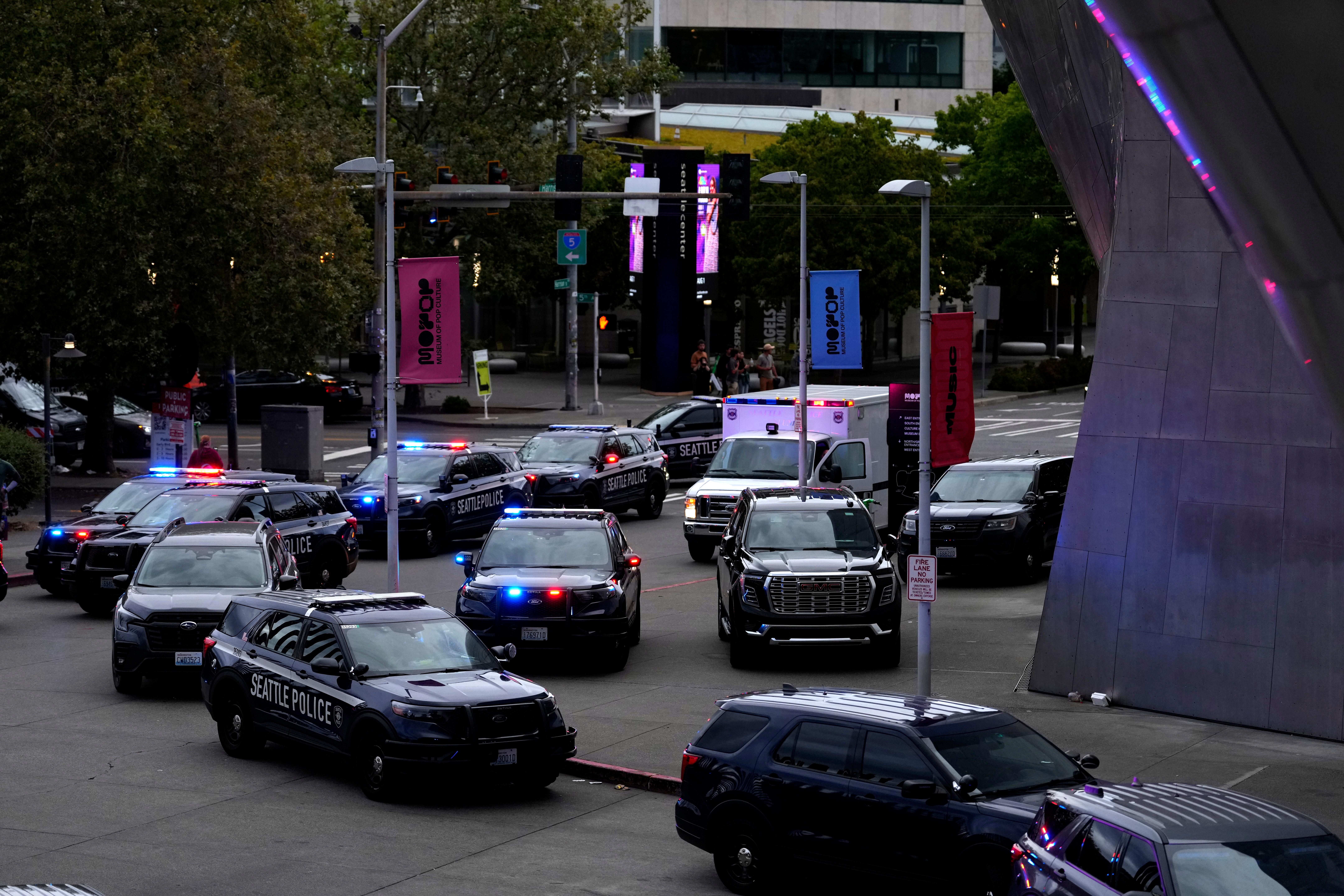 Seattle police respond to a shooting at Seattle Center during the Bite of Seattle food festival Sunday, July 26, 2026, in Seattle, Wash. (AP Photo/Lindsey Wasson)