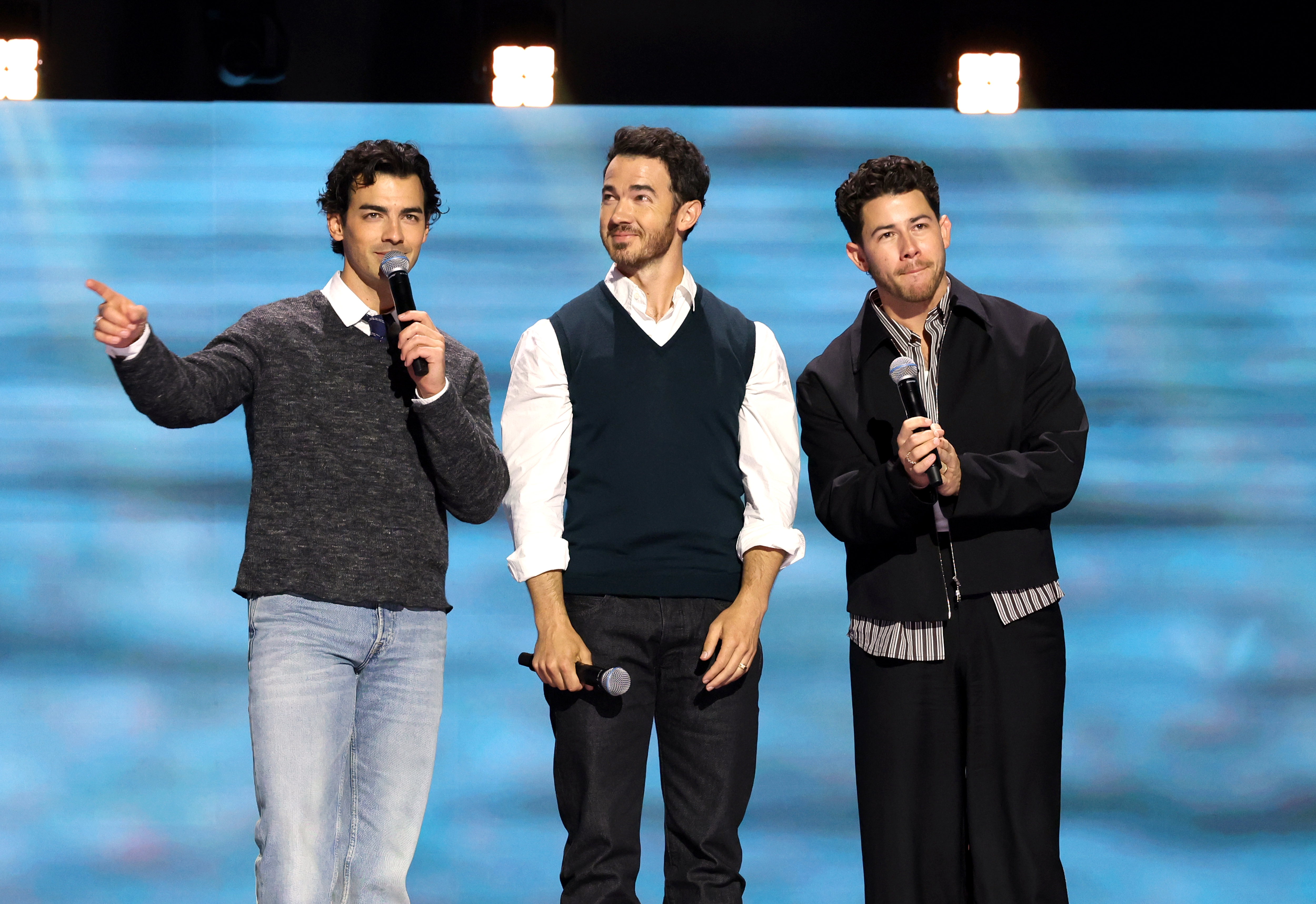 Joe Jonas, Kevin Jonas, and Nick Jonas speak onstage at the Disney Entertainment Showcase at D23: The Ultimate Disney Fan Event on August 14, 2026 in Anaheim, California (Jesse Grant/Getty Images for Disney)