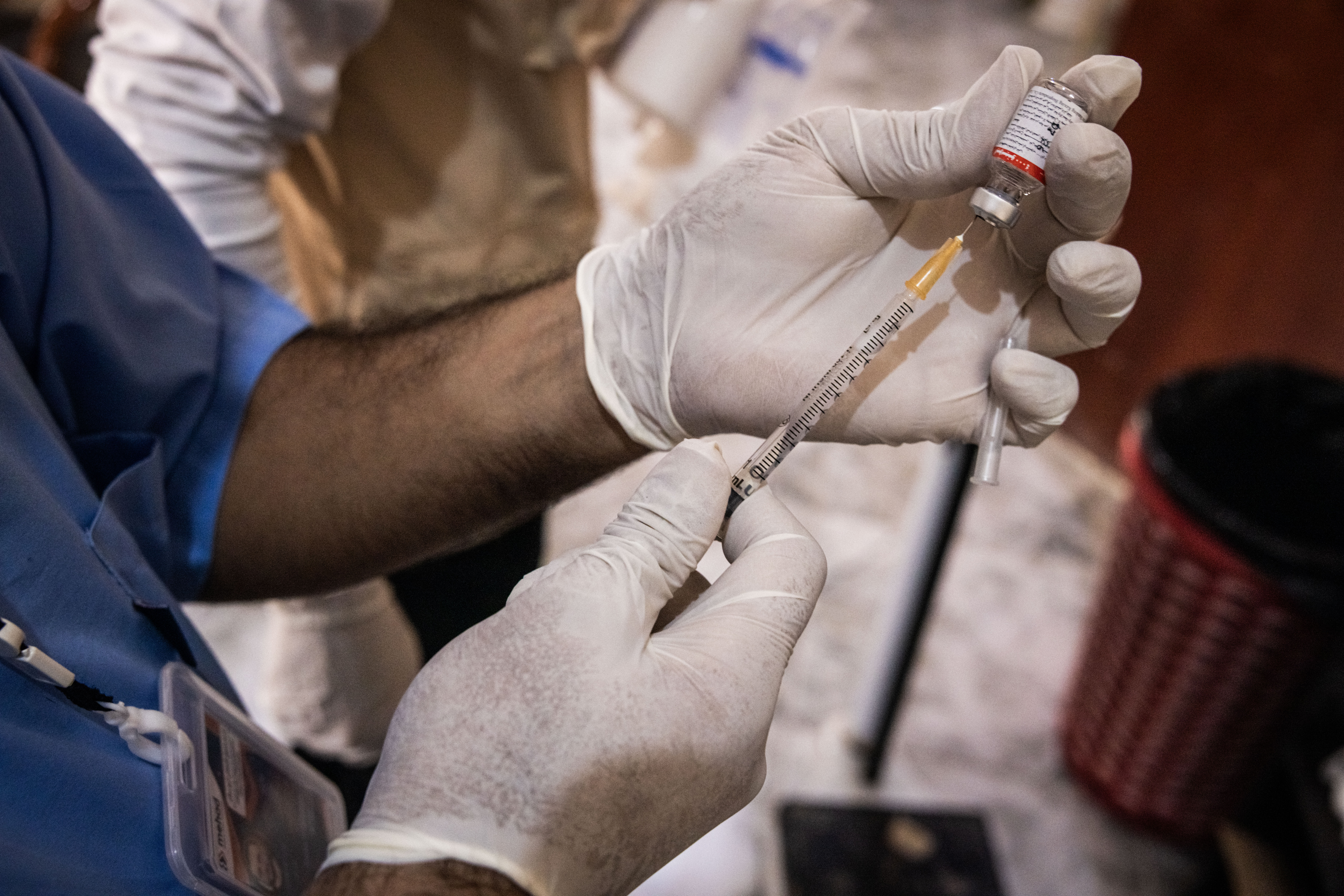 DEIR EZ ZUR, SYRIA - JUNE 22: A nurse fills a syringe to inject a patient at the dialysis centre in Abu Hamam Hospital, run by French healthcare NGO Mehad, on June 22, 2025 in Deir Ez Zur, Syria. Medical clinics in Syria have been overwhelmed as some NGO-supported facilities have been forced to close due to cuts to foreign-aid budgets, most notably the dismantling of the United States Agency for International Development (USAID) earlier this year. The three dialysis centres operated by French healthcare NGO Mehad are now the only functional ones in Northeast Syria. Medical staff at Abu Hamam Hospital say in the past five months they have had to turn away some prospective patients requiring Dialysis, who have had to go Damascus or elsewhere. Staff said the Dialysis centre is currently operating over normal capacity to meet the needs of their existing patients, as some of the machines are broken or faulty, putting further stress on working hours of staff and overusing the functioning dialysis machines. Four other Mehad dialysis centres in Syria have already shut down in recent months due to a lack of renewed funding, the NGO said in a statement. As Syria rebuilds from a 13-year civil war, the country's health services are largely dependent on NGOs in the absence of a more robust and organised healthcare system. (Photo by Ed Ram/Getty Images)