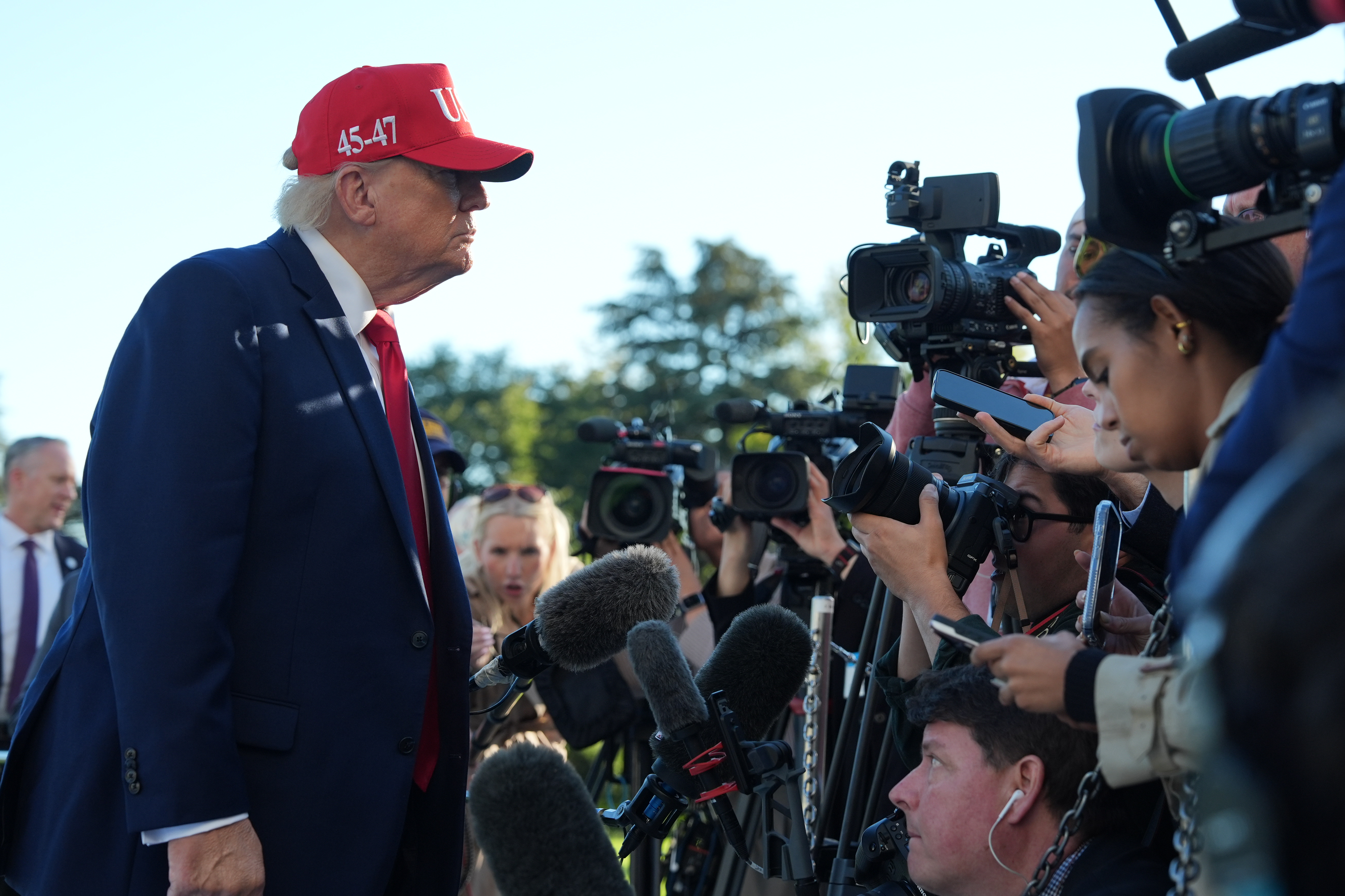 President Donald Trump speaks with reporters after arriving on Marine One from the South Lawn of the White House, Tuesday, Oct. 6, 2026, in Washington. (AP Photo/Alex Brandon)