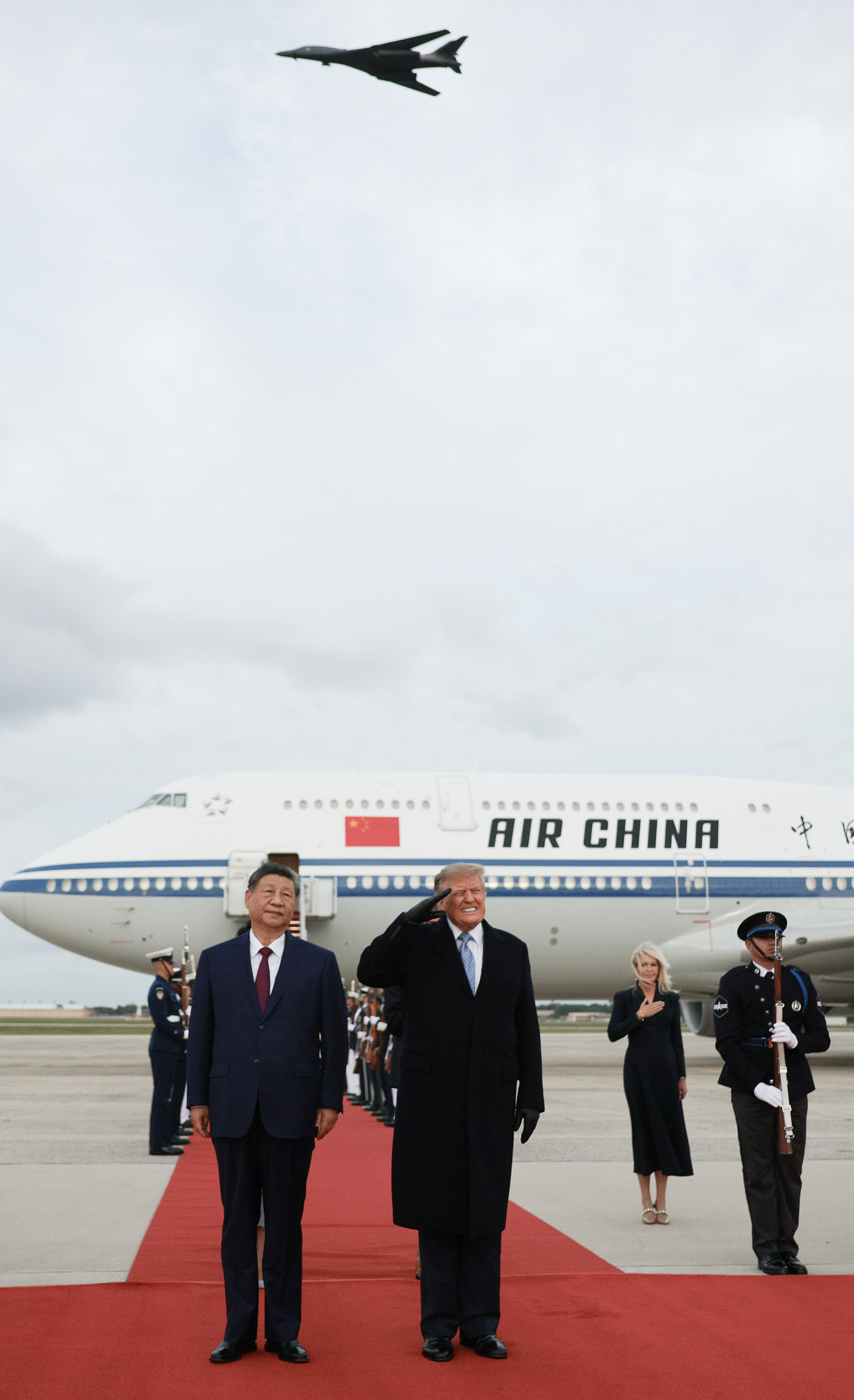 JOINT BASE ANDREWS, MARYLAND - SEPTEMBER 23: U.S. President Donald Trump (R) flinches during a flyover by a B-1 jet bomber on the red carpet with Chinese President Xi (L) Jinping during an arrival ceremony on September 23, 2026 at Joint Base Andrews, Maryland. President Trump is hosting President Xi for a three-day state visit to Washington, DC where the leaders are expected to discuss trade practices, artificial intelligence and furthering “strategic stability” between their countries. (Photo by Chip Somodevilla/Getty Images)