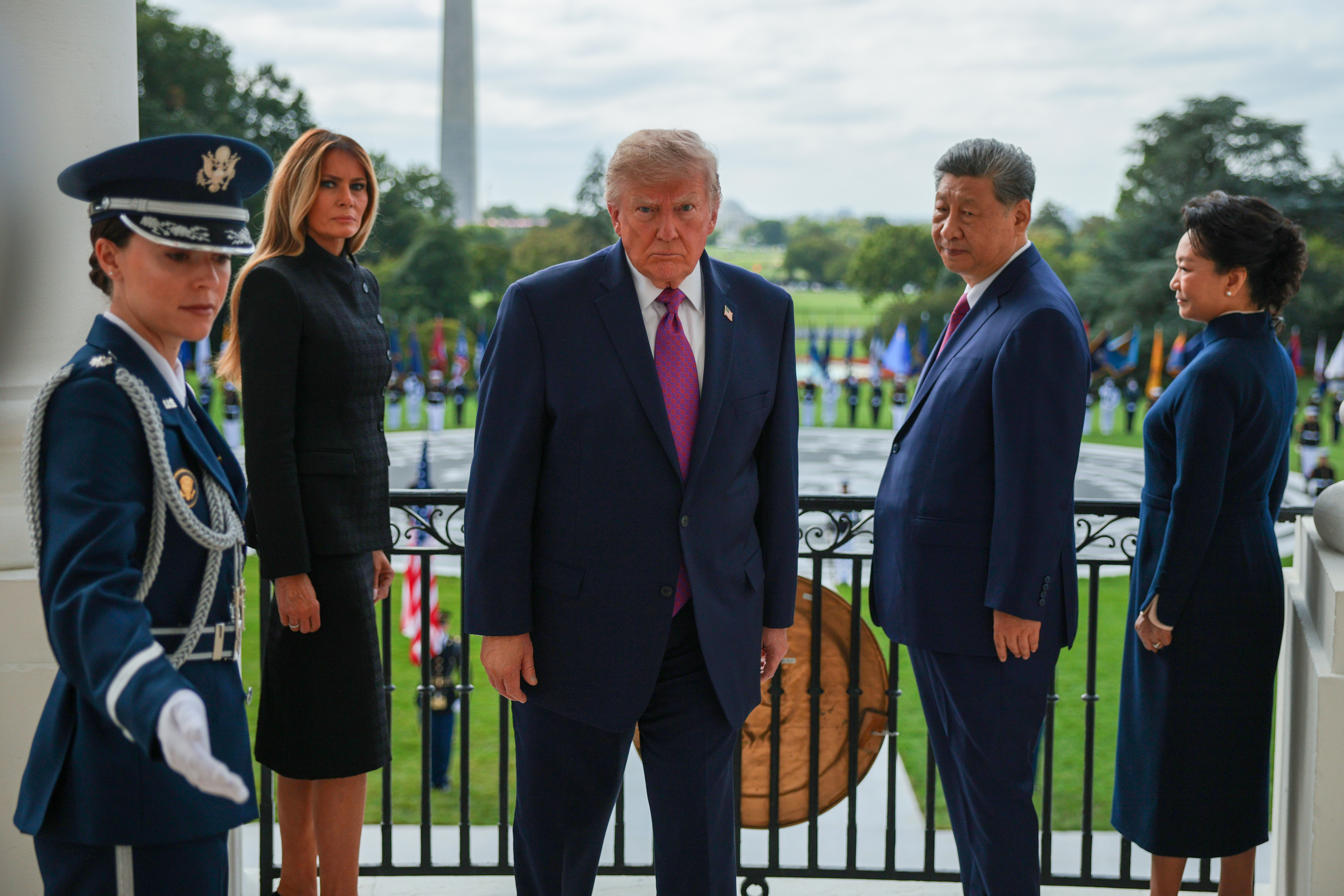 WASHINGTON, DC - SEPTEMBER 24: (L-R) A military aide, U.S. first lady Melania Trump, U.S. President Donald Trump, President&nbsp;of&nbsp;China Xi Jinping, and first lady of China Peng Liyuan depart a balcony after watching a Silent Drill Platoon Review at the White House on September 24, 2026 in Washington, DC. President Trump is hosting President Xi for a three-day state visit to Washington, DC where the leaders are expected to discuss trade practices, artificial intelligence and furthering