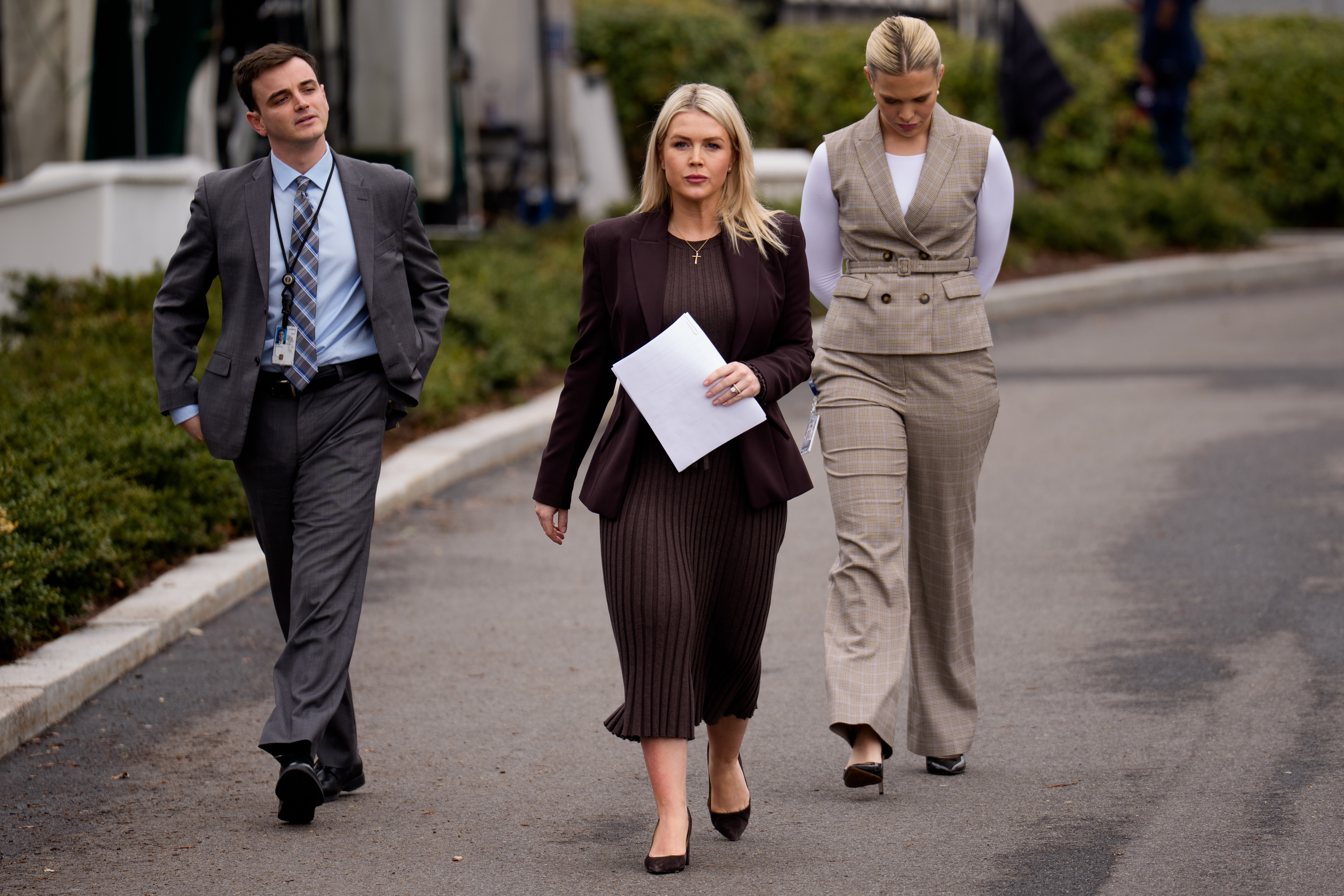 WASHINGTON, DC - MARCH 6: White House Press Secretary Karoline Leavitt (C) walks back towards the White House after a television interview on the North Lawn on March 6, 2026 in Washington, DC. Leavitt took questions from reporters after the interview on the ongoing U.S. and Israeli attacks on Iran and other topics. (Photo by Andrew Harnik/Getty Images)