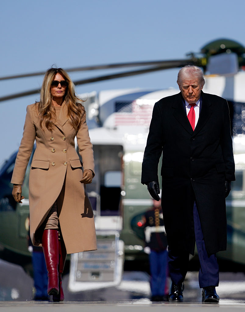 JOINT BASE ANDREWS, MARYLAND - FEBRUARY 13: U.S. President Donald Trump and First Lady Melania Trump make their way from Marine One to board Air Force One on February 13, 2026 at Joint Base Andrews, Maryland. Trump will visit Fort Bragg in North Carolina and then travel to Florida for the weekend. (Photo by Nathan Howard/Getty Images)
