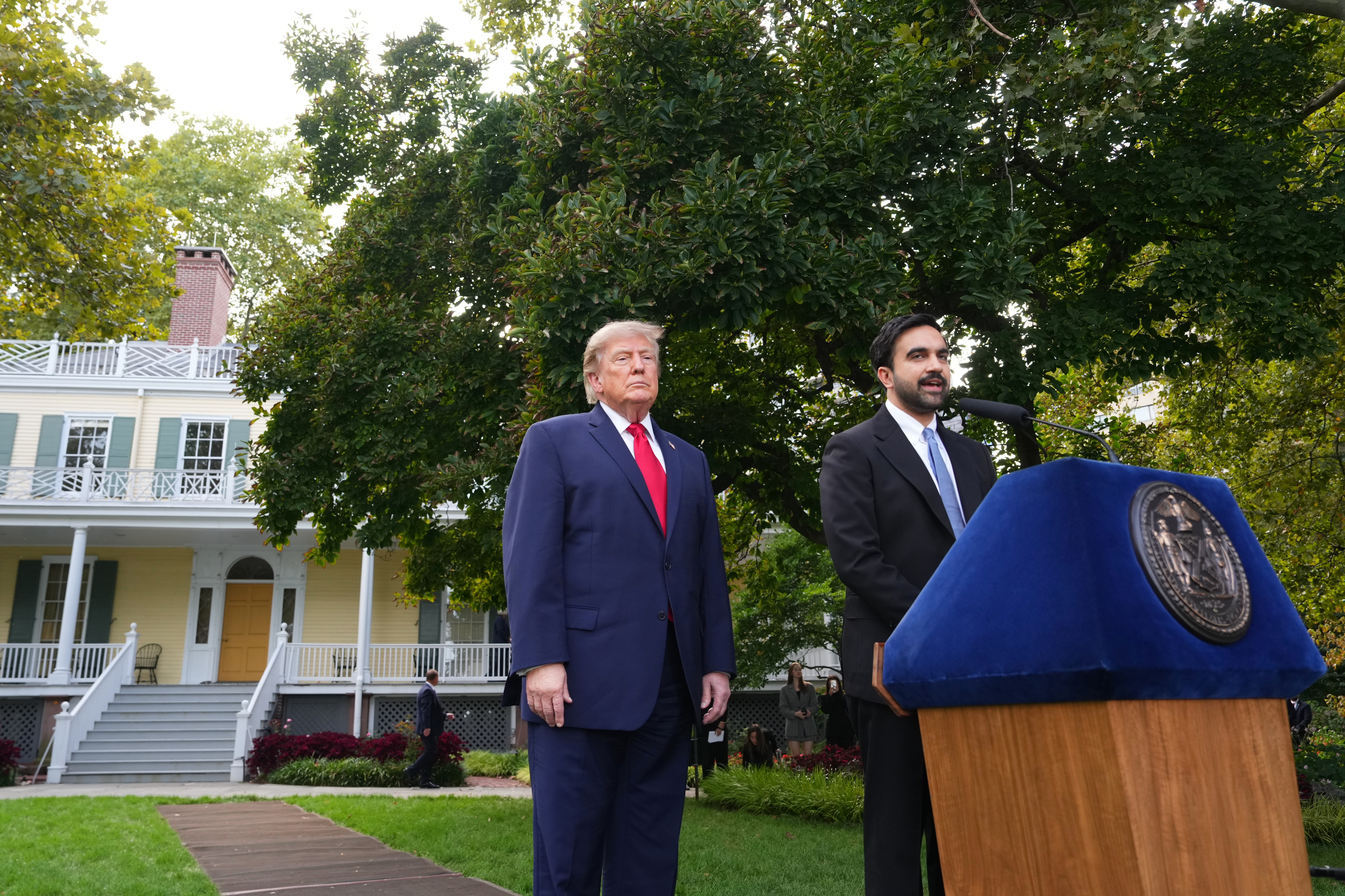 President Donald Trump, left, stands as New York City Mayor Zohran Mamdani speaks to media after their meeting Monday, Sept. 21, 2026, in New York. (AP Photo/Adam Gray)