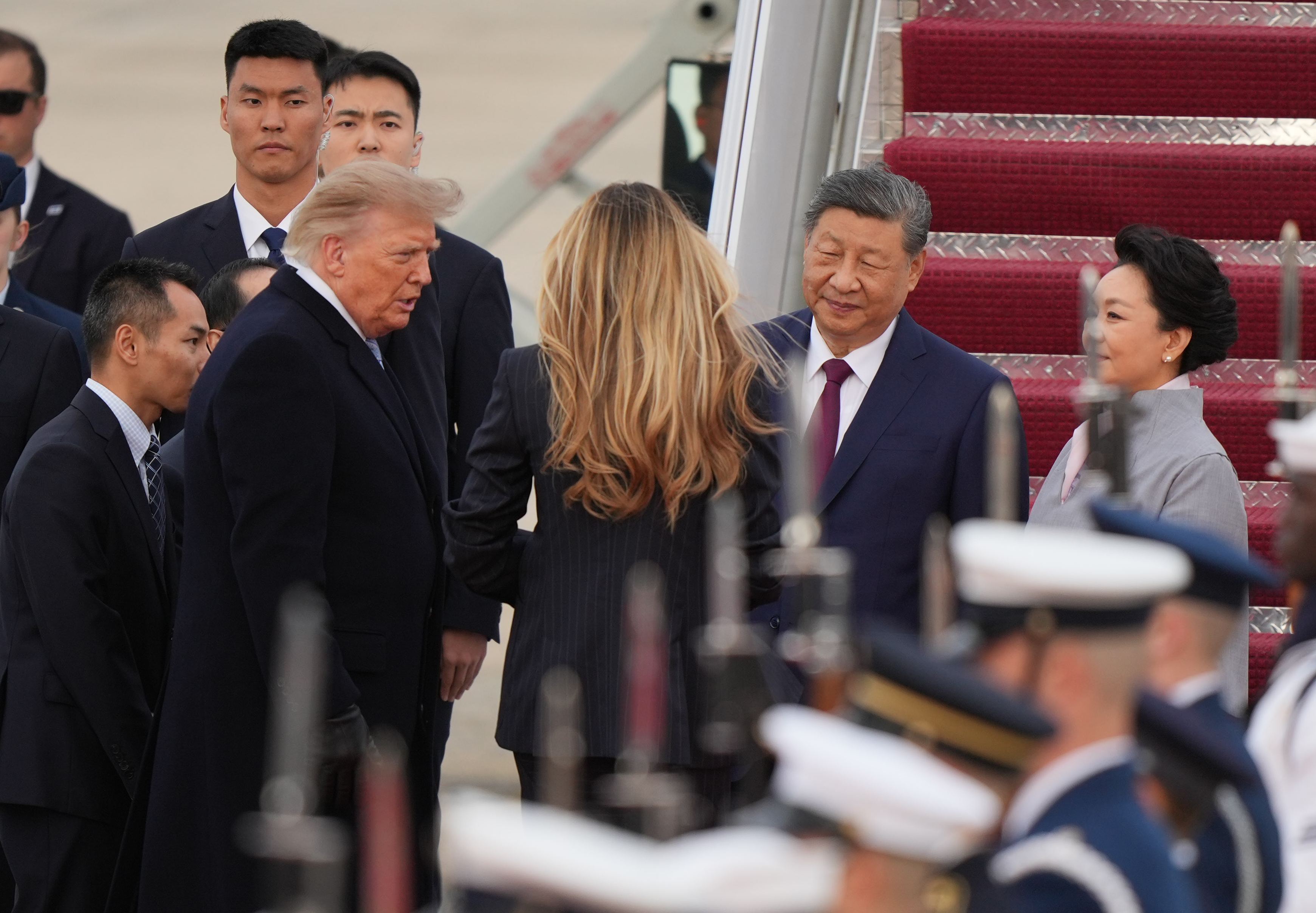 President Donald Trump and first lady Melania Trump greet Chinese President Xi Jinping and his wife Peng Liyuan as they arrive at Joint Base Andrews, Md., Wednesday, Sept. 23, 2026. (AP Photo/Mark Schiefelbein)