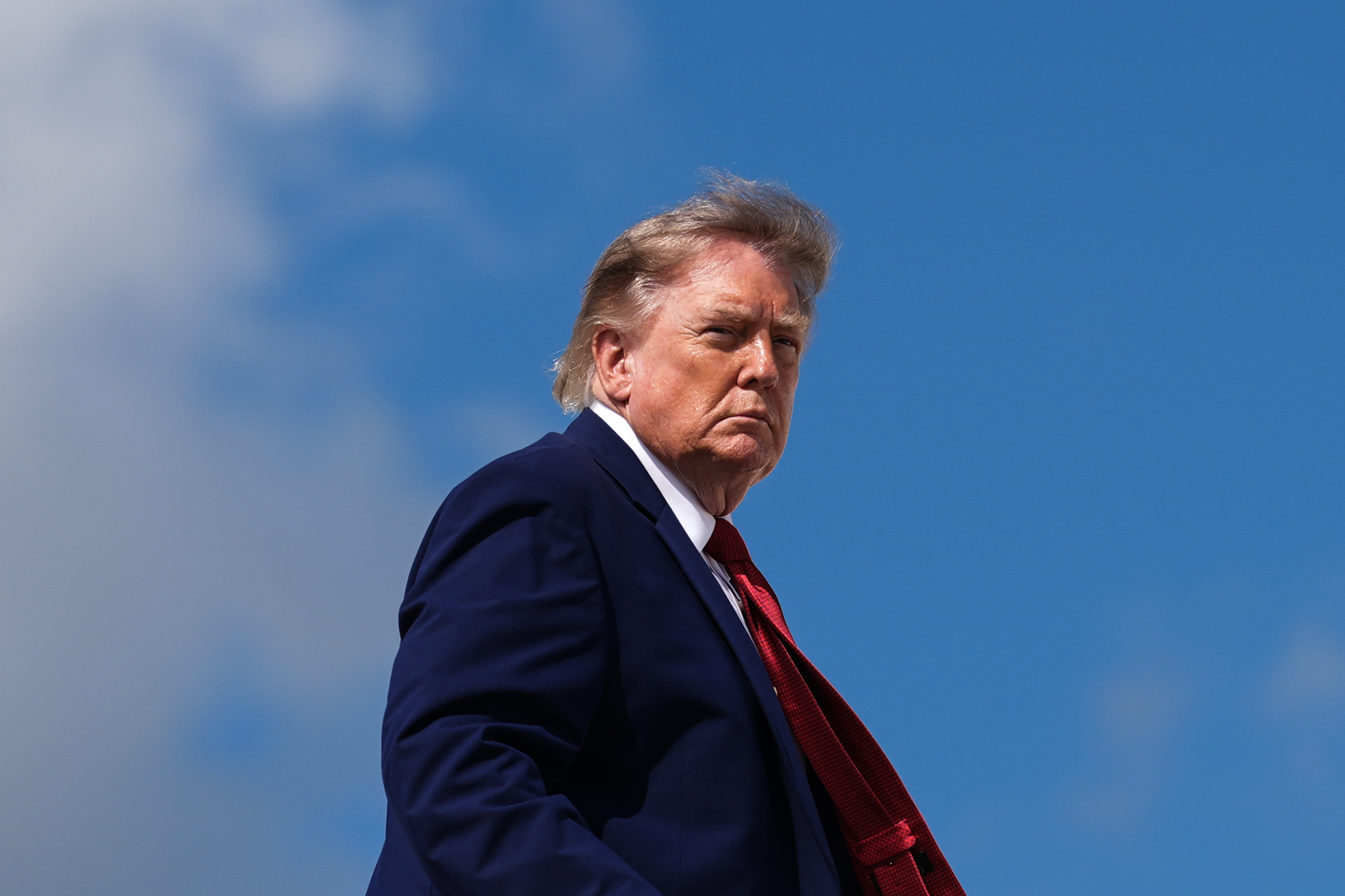 FILE - President Donald Trump boards Air Force One, Aug. 7, 2026, at Joint Base Andrews, Md. (AP Photo/Julia Demaree Nikhinson, File)