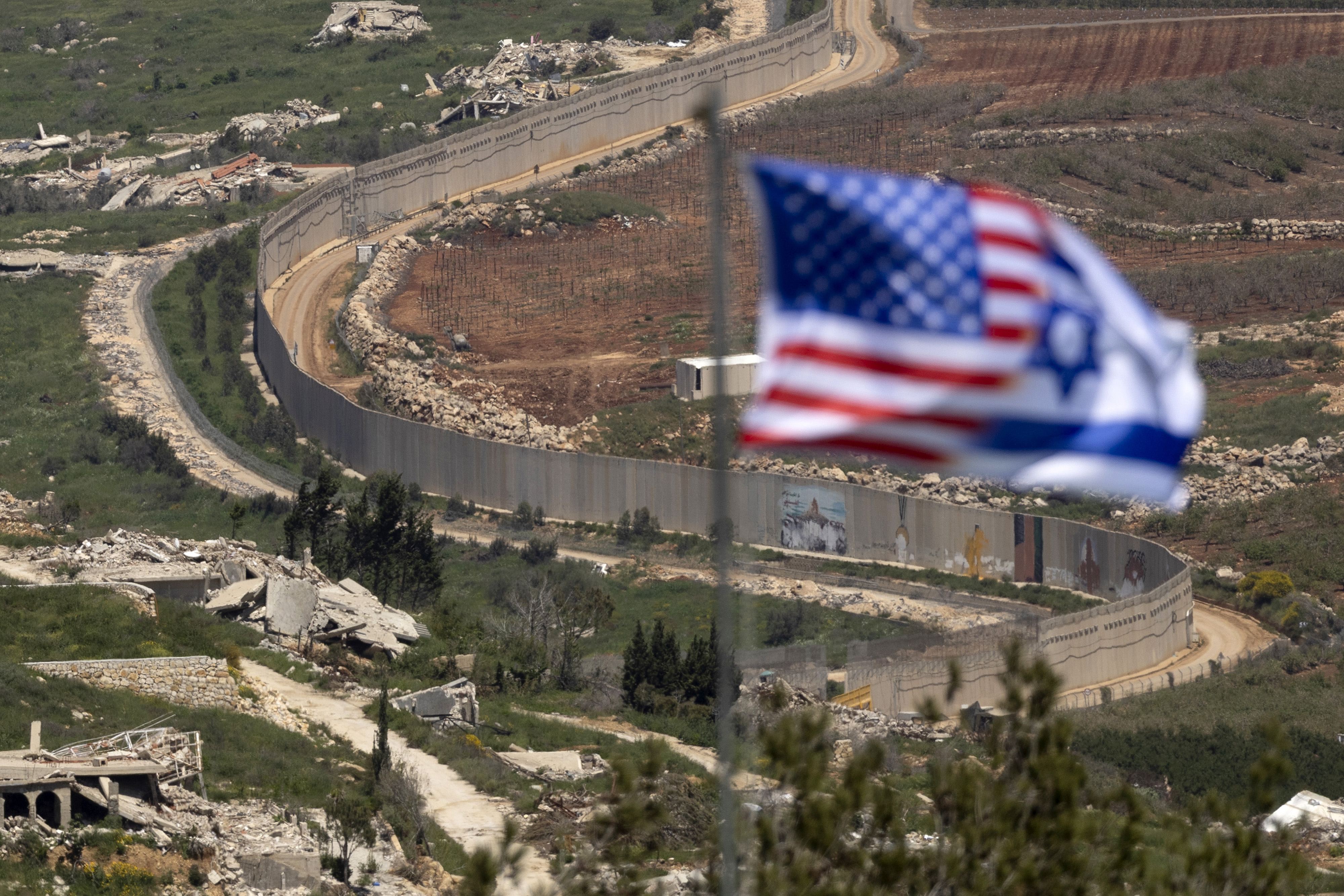 NORTHERN ISRAEL, ISRAEL - APRIL 29: An Israeli and US flag is seen near the border with Southern Lebanon, as seen from a position on the Israeli side of the border on April 29, 2026 in Northern Israel, Israel. Israel has continued to launch strikes and issue evacuation orders for parts of southern Lebanon despite the ongoing ceasefire, accusing Hezbollah of violating the agreement. Last week, an original 10-day ceasefire agreed by Israel and Lebanon was extended another three weeks. (Photo by Amir Levy/Getty Images)
