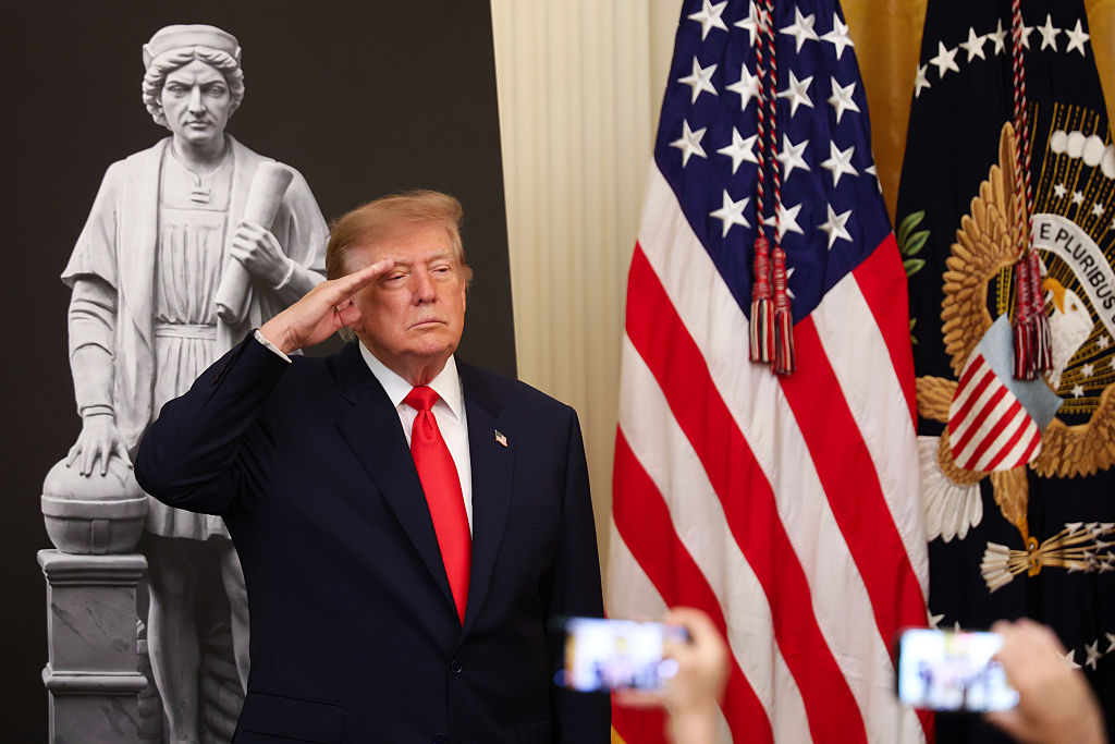 WASHINGTON, DC - OCTOBER 09: U.S. President Donald Trump salutes as he arrives for a Columbus Day event in the East Room of the White House on October 09, 2026 in Washington, DC. The U.S. celebrates Columbus Day on Monday, October 12. (Photo by Kevin Dietsch/Getty Images)